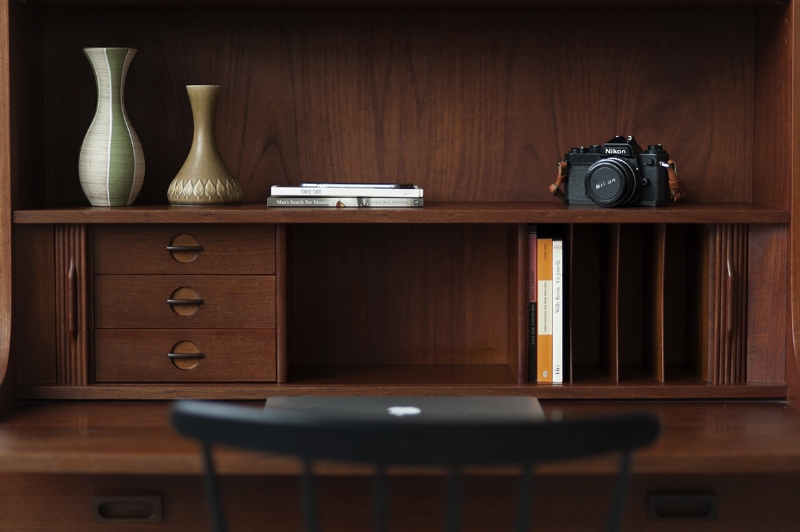Functional vintage Danish tall secretary bookshelf by Johannes Sorth with pull out desk.