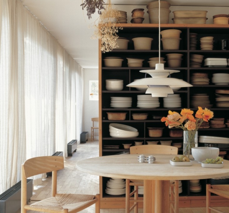 Grethe Meyer’s dining room is filled with ceramics of her own design and furniture pieces by her friend, Børge Mogensen. The cozy shaker dining table and J39 chairs by Mogensen sit beneath another Danish classic, the PH 5 pendant lamp from 1958, designed by Poul Henningsen for Louis Poulsen.