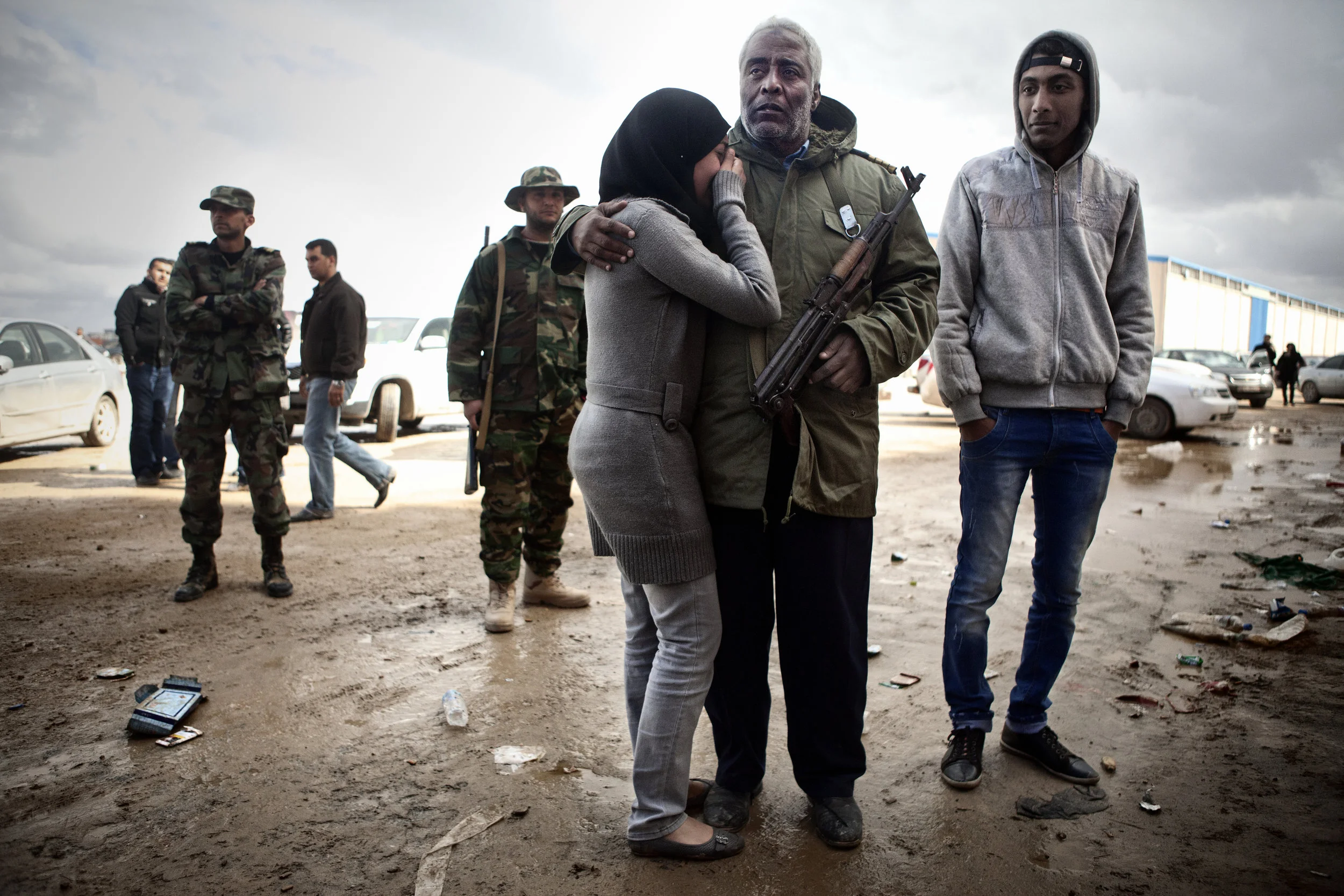 2/26/2011 Benghazi, Libya  A young woman cry's and hugs her father, a defecting Libyan soldier who is staying in Benghazi, before boarding a ferry for evacuation to Tunis. 