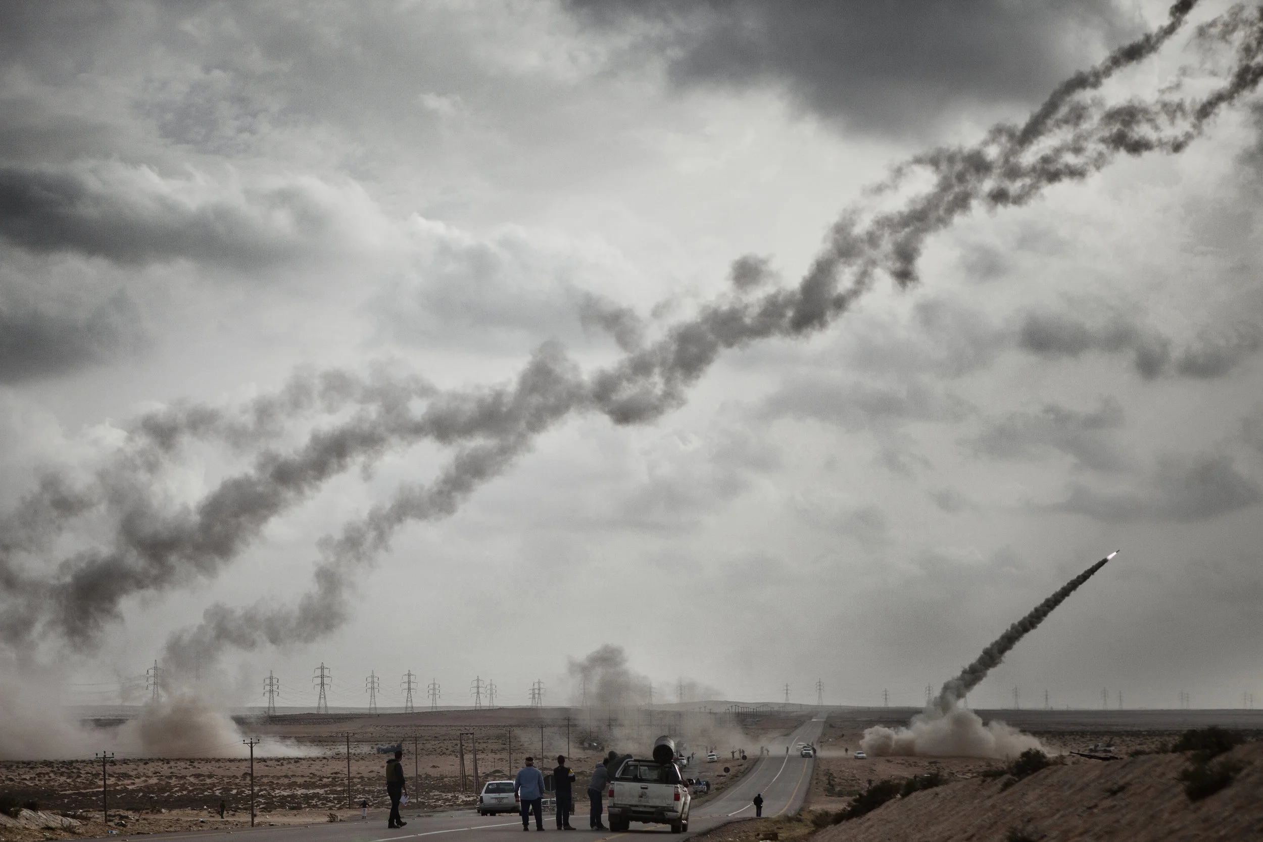  4/6/2011 New Brega, Libya  Anti-Qaddafi rebel fighters fired rockets towards Pro-Qaddafi military positions near the oil refinery in Brega. The Brega frontline would remain static for much of the 6-month revolution.  