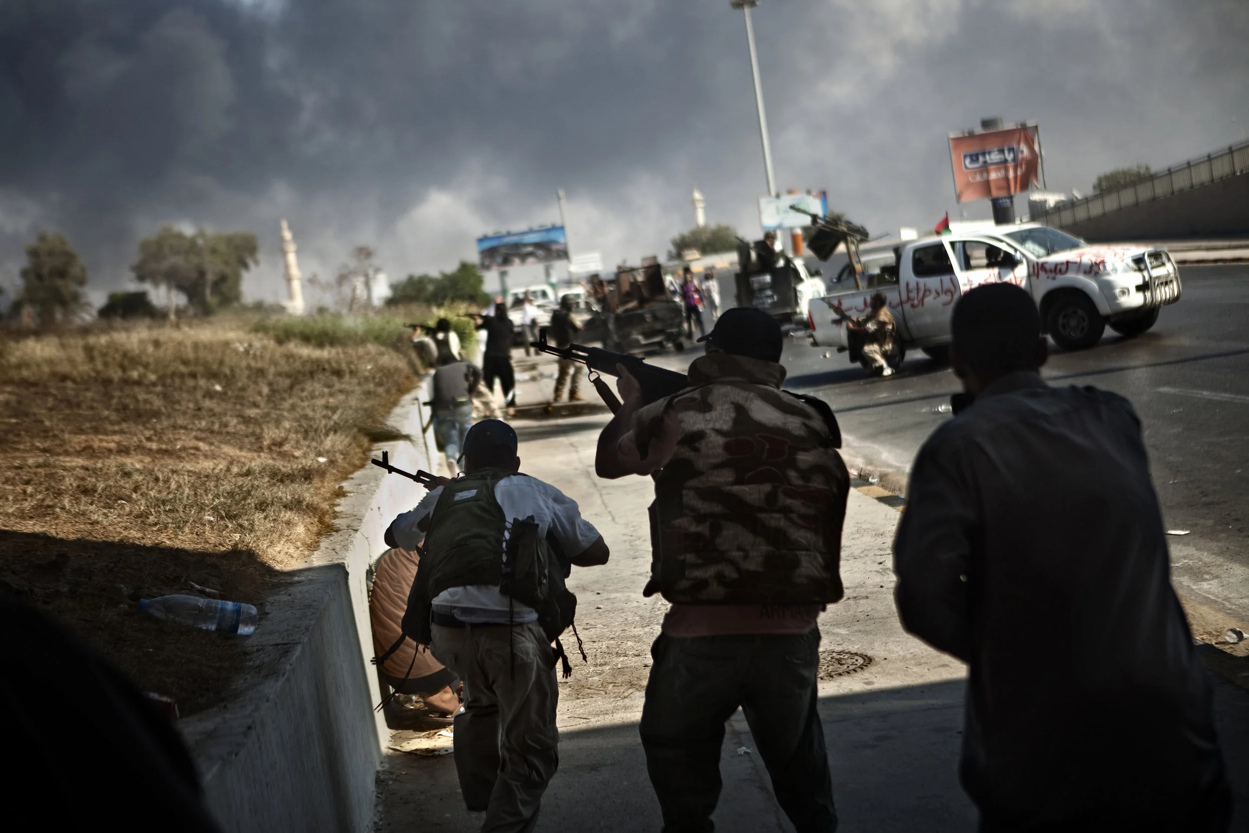  8/23/2011, Tripoli, Libya  Libyan rebels battled cells of Qaddafi loyalists in the Souk al-Thalatha district, near the front gates of Bab al-Azizia, as anti-Qaddafi forces made their final assault on the embattled dictators compound. 