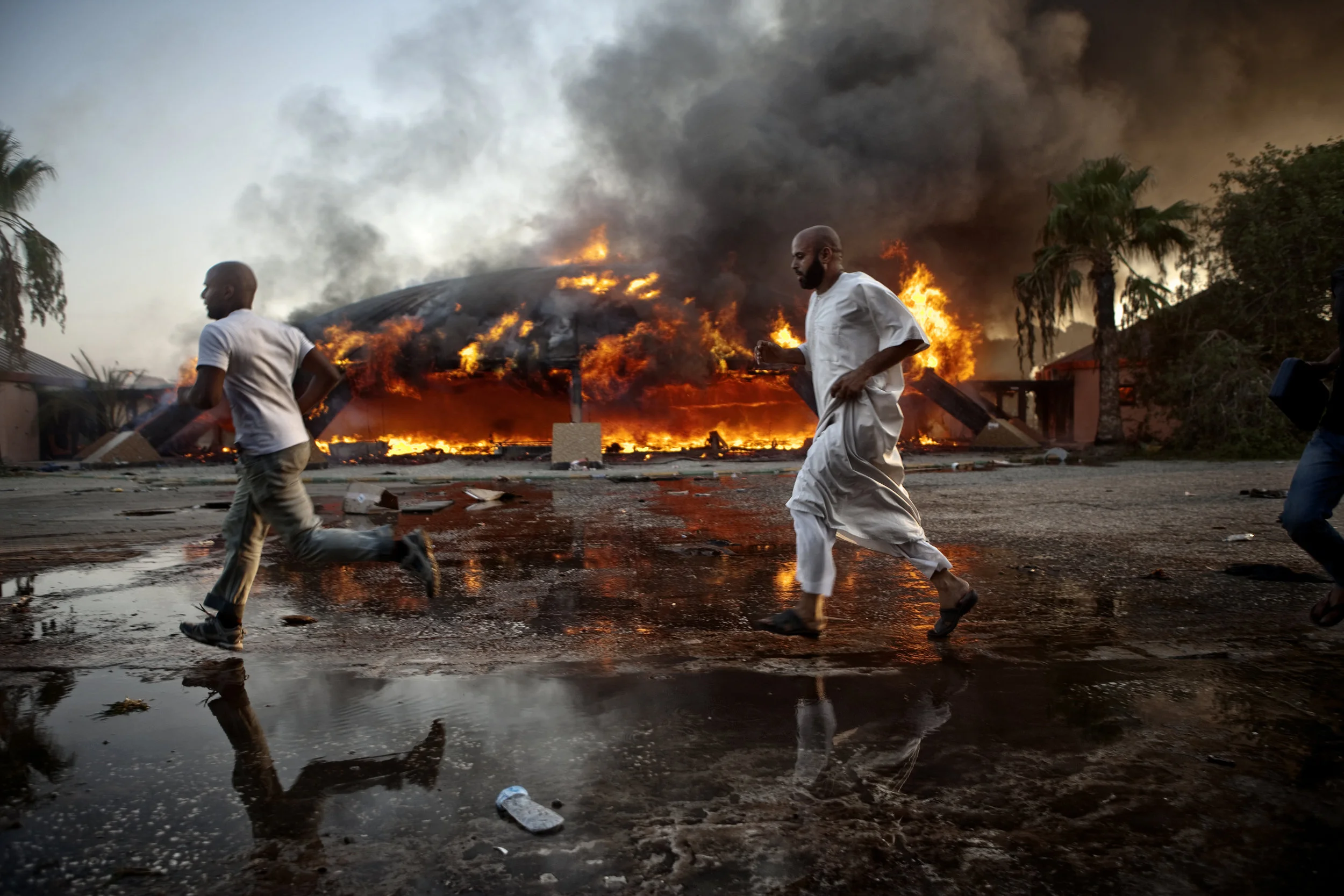  8/23/2011, Tripoli, Libya  Libyan residents of Tripoli stormed through the Bab al-Azizia compound in search of weapons, as rebel forces finally breached it’s gates, burning structures and sifting through the cloistered private life of deposed dictat