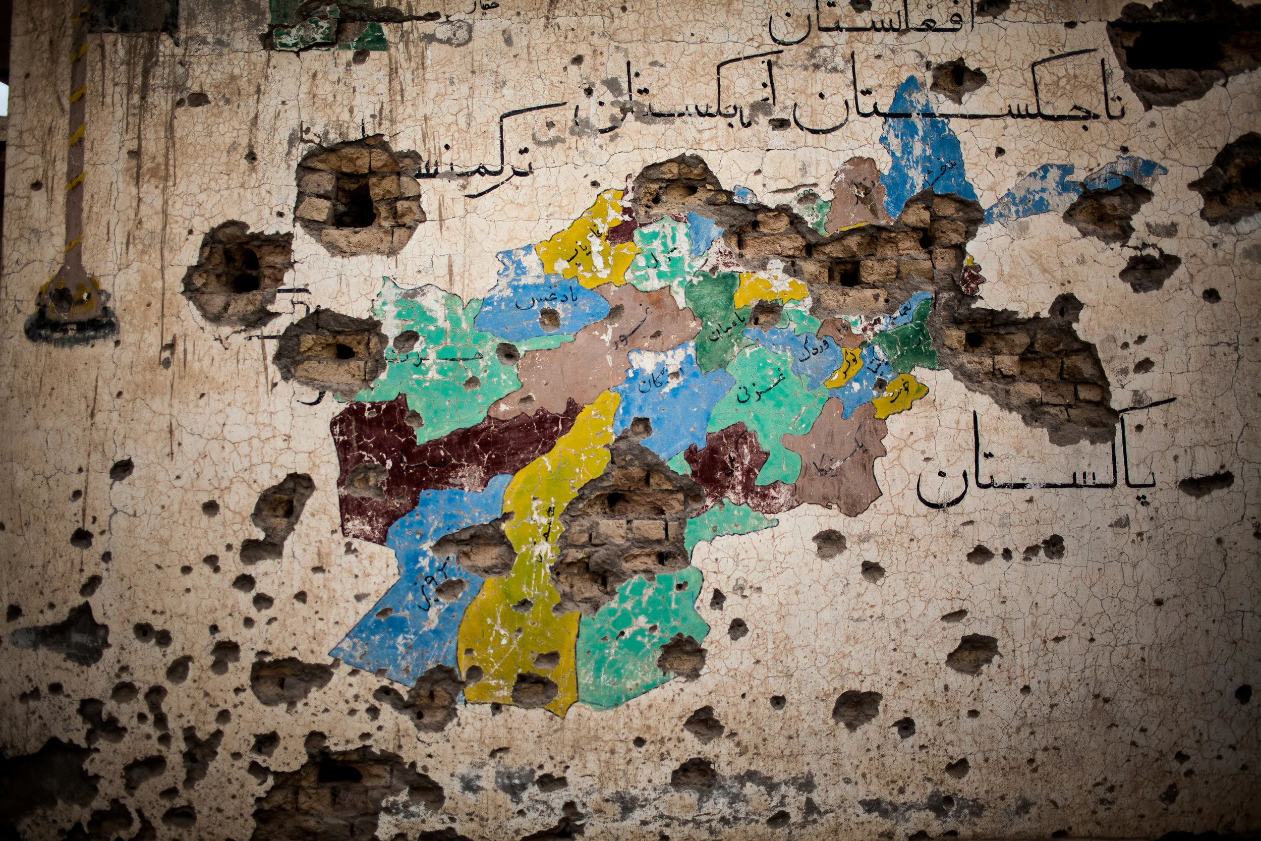  Tieranon, Pashmul District, Kandahar Province, Afghanistan. 2013.  A map of Afghanistan was pockmarked by shell holes from US ordinance after a battle with anti-Afghan Government insurgents in Kandahar’s Pashmul district. Pashmul was on of the most 