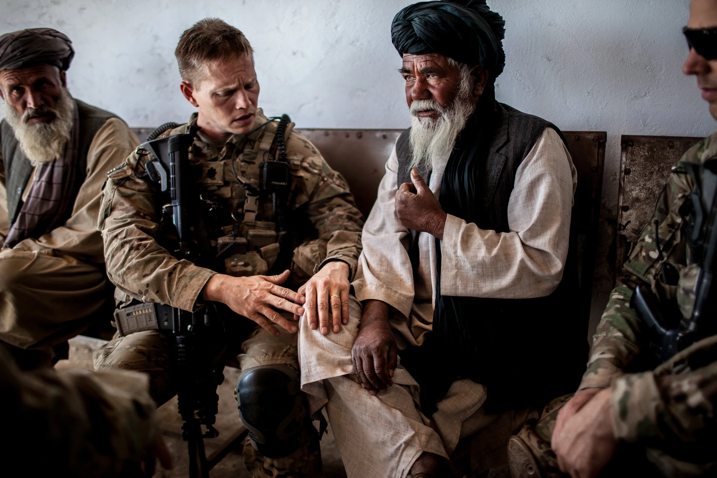  Sangsar, Kandahar Province, Afghanistan. 2012.  Lt. Col. Guy Jones, commander of the 508th Parachute Infantry Regiments Second Battalion, spoke to a village elder, placing his hand on his knee, during a shura with locals in Sangsar, Kandahar Provinc