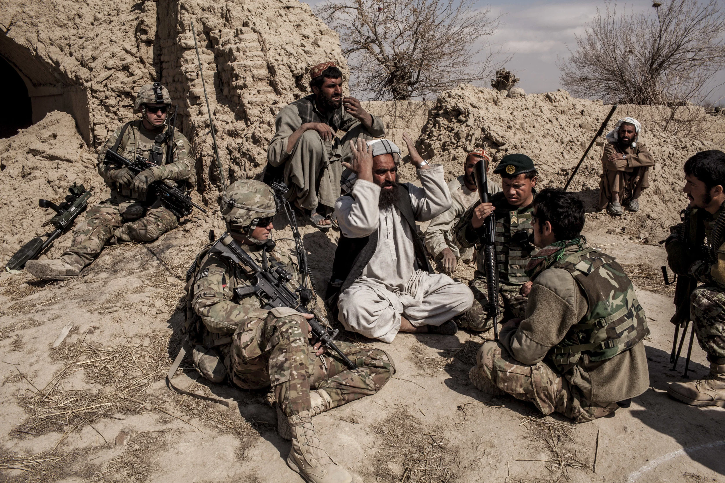  Layadira, Pashmul District, Kandahar Province, Afghanistan. 2013  A poppy farmer in the small hamlet of Layadira in Pashmul, Kandahar Province, through up his hands in frustration as Lt. Melin of 3rd Bat. 1st Armored Div. left, and an Afghan interpr