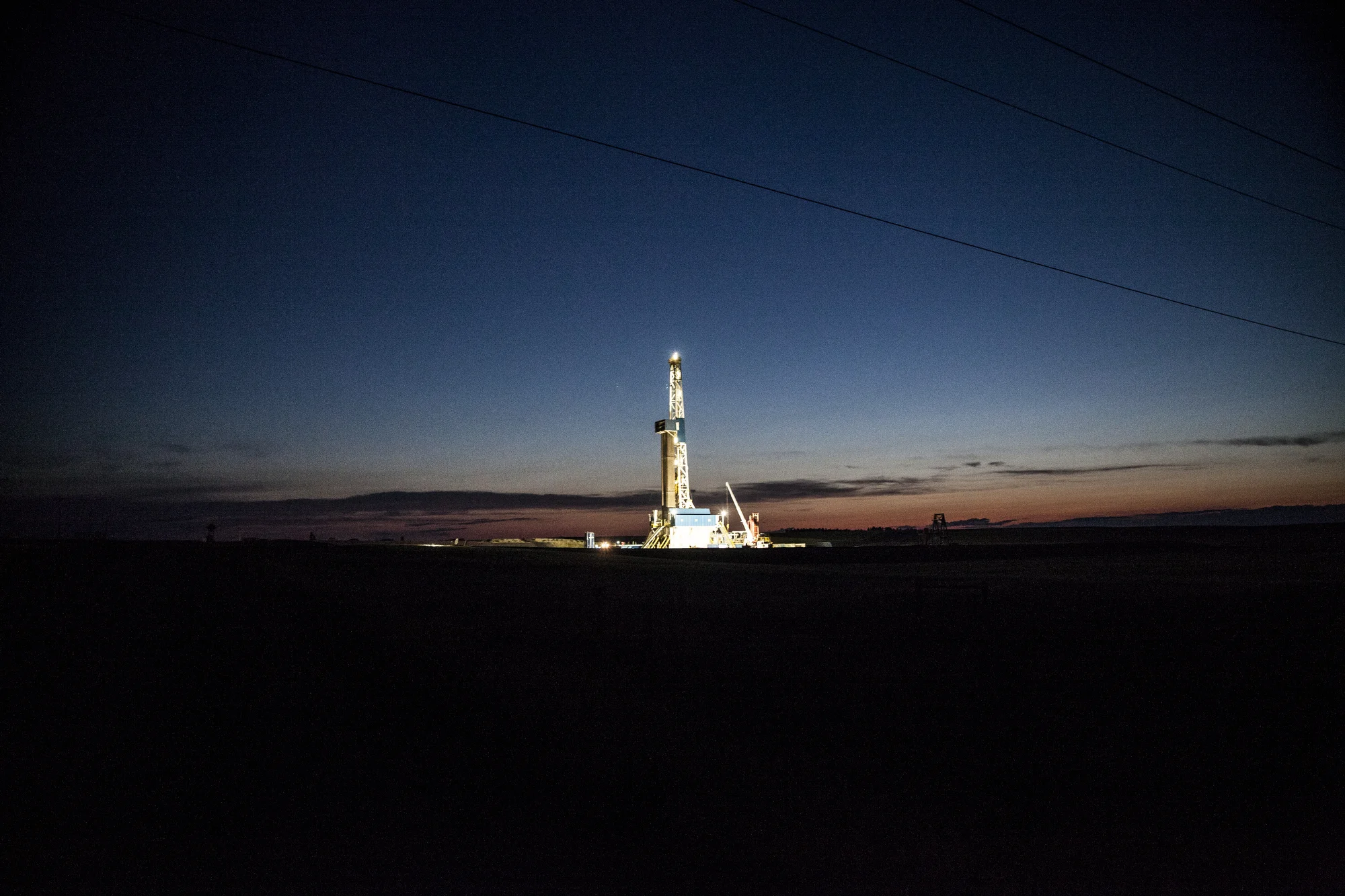  7/22/2014 Williston, North Dakota  An oil drigging rig run by the Norwegian firm Statoil was illuminated against the night sky outside Williston, North Dakota. 