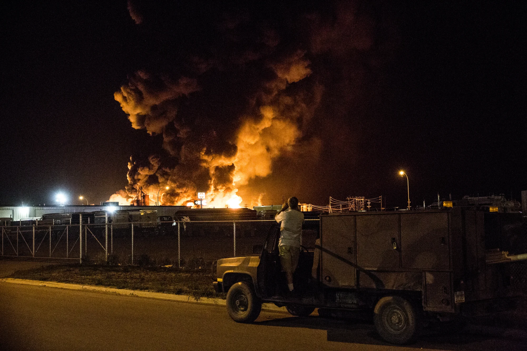  7/22/2014 Williston, North Dakota  A local resident of Williston, North Dakota watched as a massive fire fueled by chemicals used in the hydraulic fracturing process, referred to as "fracking," burned out of control at the Red River Supply complex i