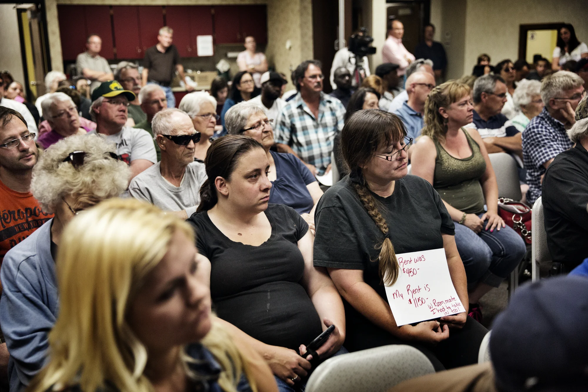  7/17/2014 Williston, North Dakota  Local residents of Williston attended an affordable housing meeting at the Williston community library. Many of them, particularly the elderly, live on fixed incomes, and have seen their rents rise and eviction not
