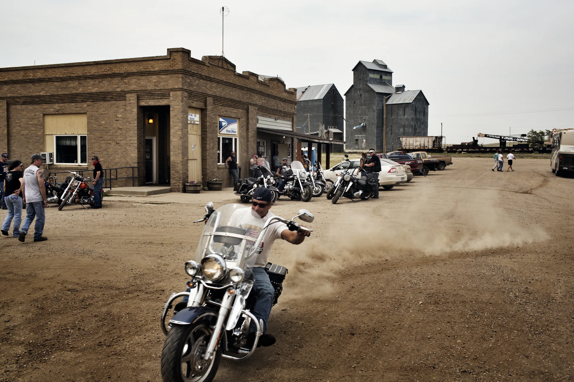  7/20/2014 Epping, North Dakota  A biker peeled out of the main intersection of Epping, North Dakota, a small town with a population of around 100 that is steadily growing as oil production ramps up in the area. 