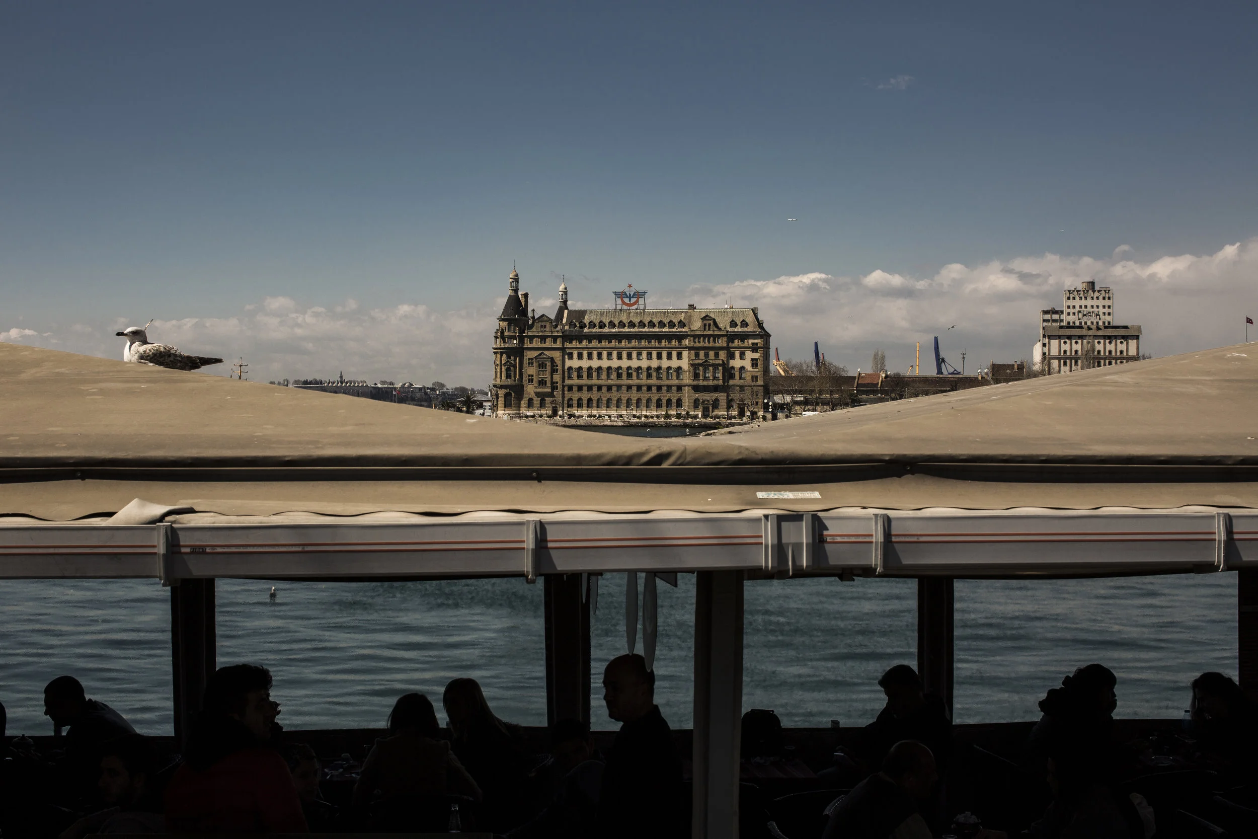  4/4/2015 Istanbul, Turkey  People ate lunch in the shadow of the Hyderpasa train station on the Asian side of Istanbul, seen in the background here. Over 200 Armenian intellectuals were deported aboard trains that left Hyderpasa for Ankara, followin