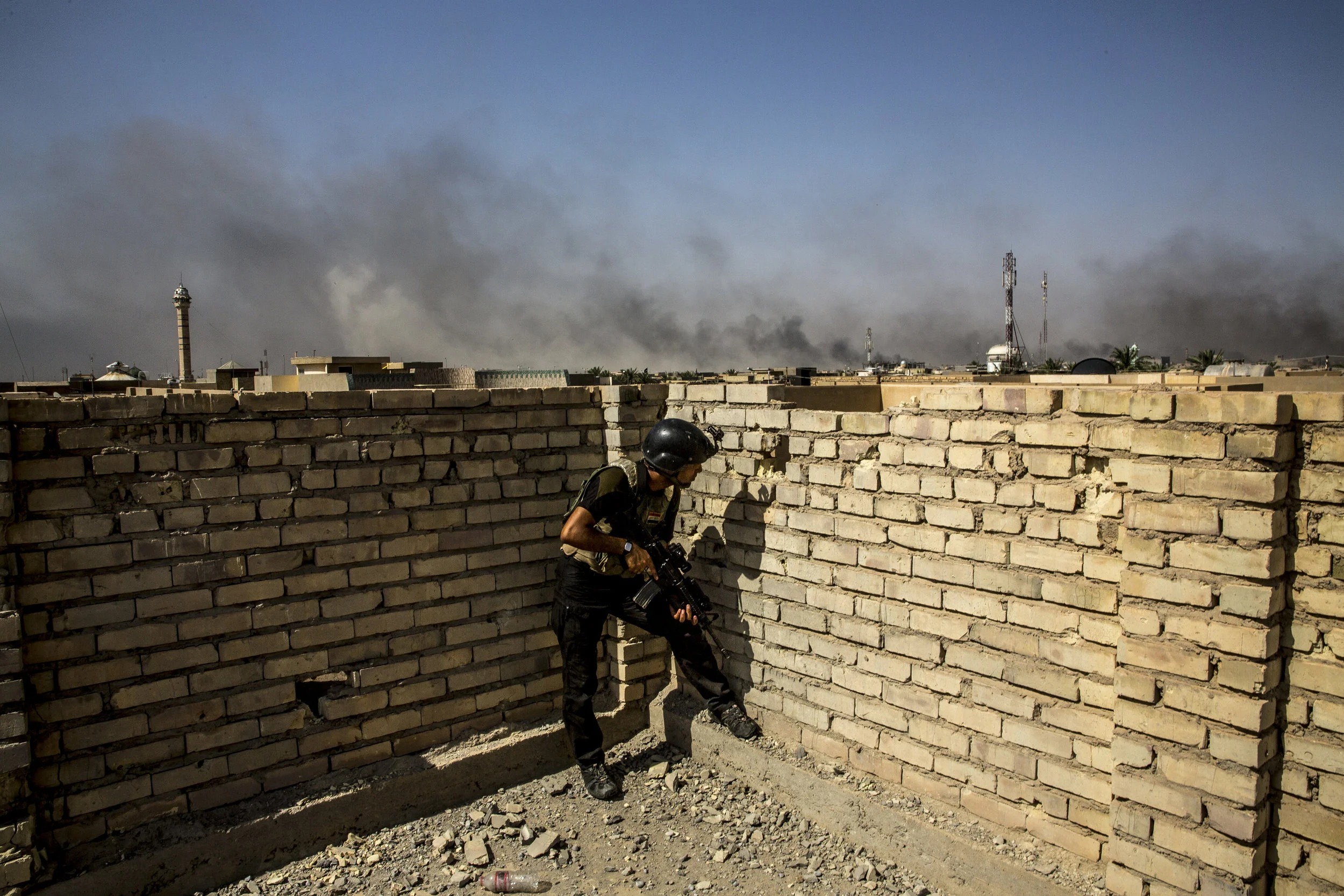  6/25/2016 Fallujah, Iraq  A member of the Iraqi Special Forces maintained watch from a rooftop position as Iraqi Forces began to push into the al-Jolan district of Fallujah, Saturday. 