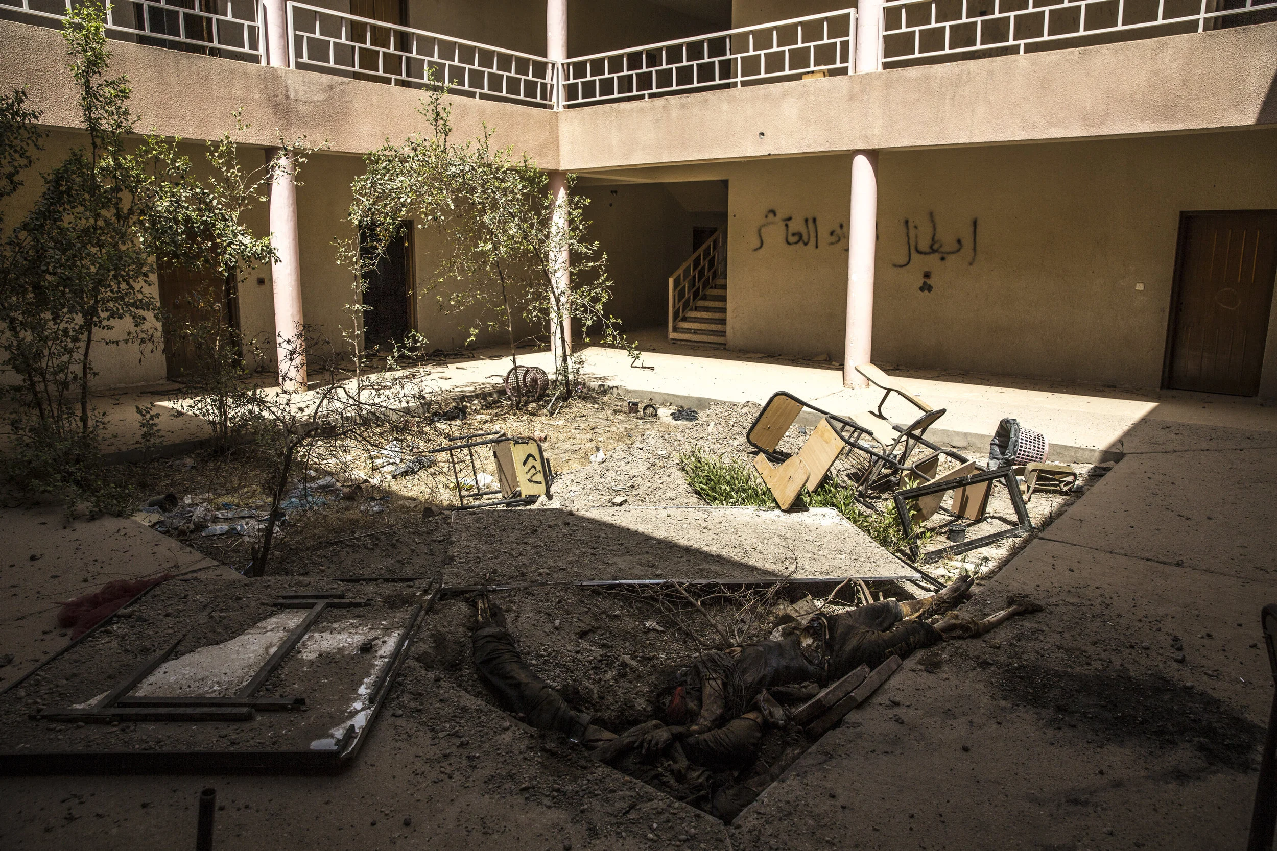  6/29/2016 Fallujah, Iraq  The bodies of unknown prisoners, executed by ISIS, were found near the prison complex, in a school, in the al-Mualamin district of Fallujah, in the days following the battle. With the city still not completely cleared, they