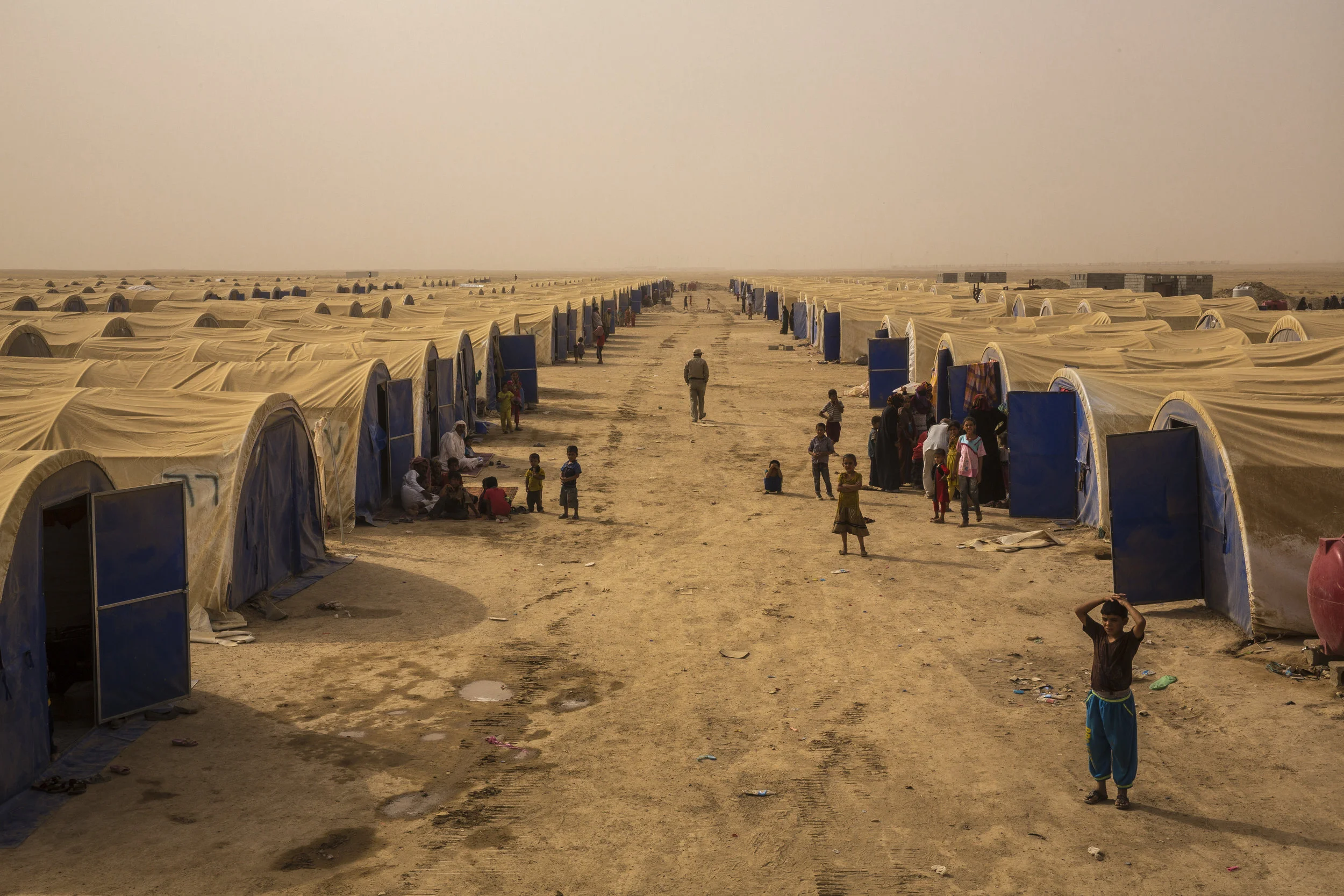  6/28/2016 Habbaniyeh, Iraq  Internally displaced Sunni’s milled about outside their tents in a dusty IDP camp in Habbaniyeh. The battle for Fallujah has displaced hundreds of thousands, with no clear indicators as to when people will be able to retu