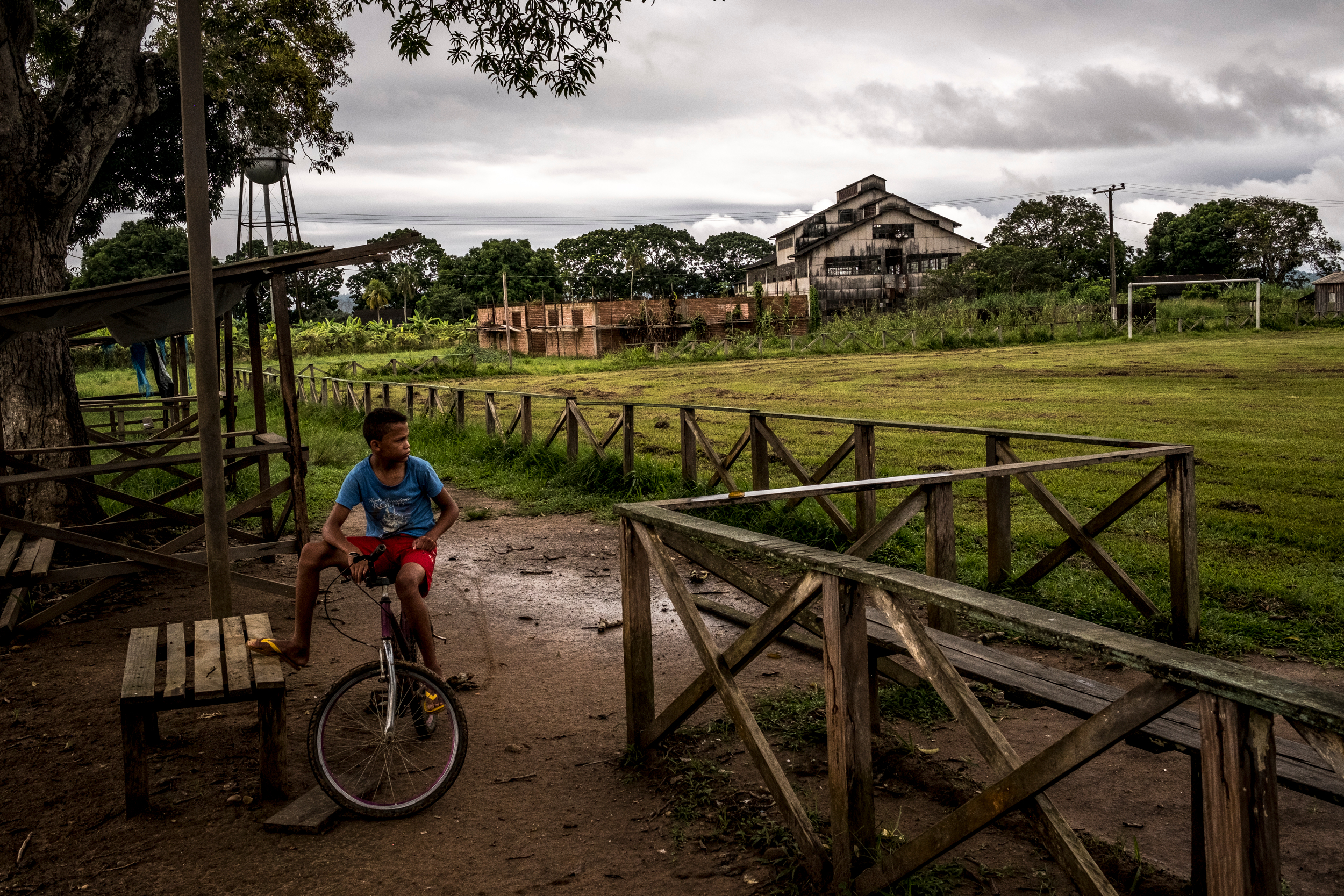  2/6/2017 Fordlandia, Brazil  A young resident of Fordlandia paused on his bike near the workshops and warehouses that were the center of Ford's project in Fordlandia. 