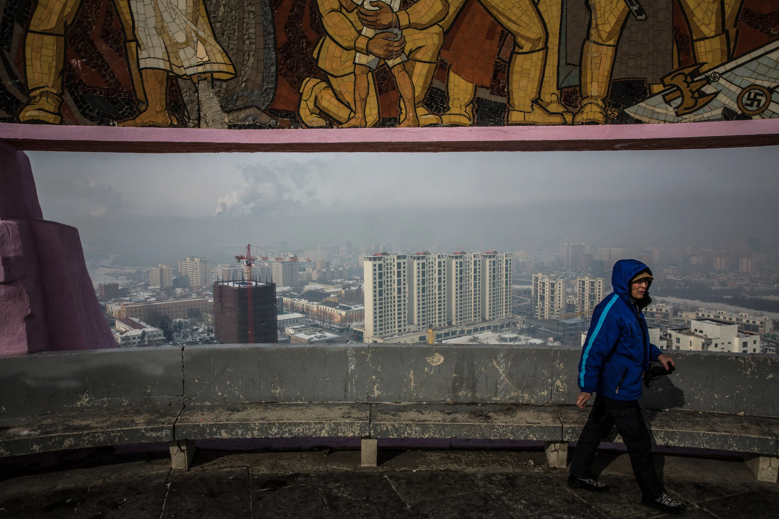  2/21/2018 Ulaanbaatar, Mongolia  Ulaanbaatar's rising skyline, framed by a Soviet era monument to the founding of the modern Mongolian state offer two bold views of how much the last century has changed life for average Mongolians. 