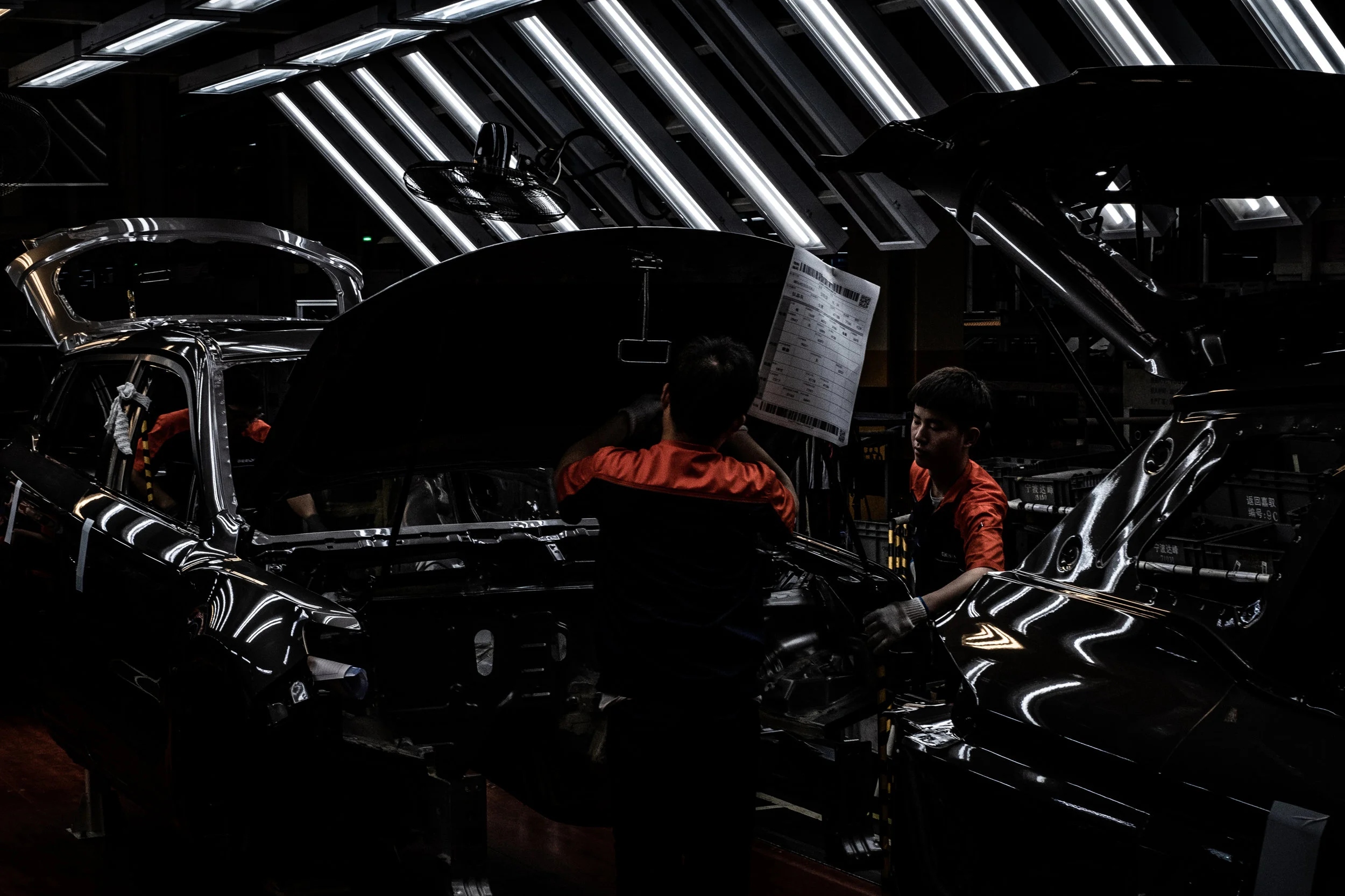  5/25/2018 Beilun, China  Chinese auto workers assembled an SUV on the Geely assembly line at their Chunxiao Plant in the Beilun District of Zheijiang Province, China. Geely, one of China's largest automotive manufactures, has been growing rapidly in