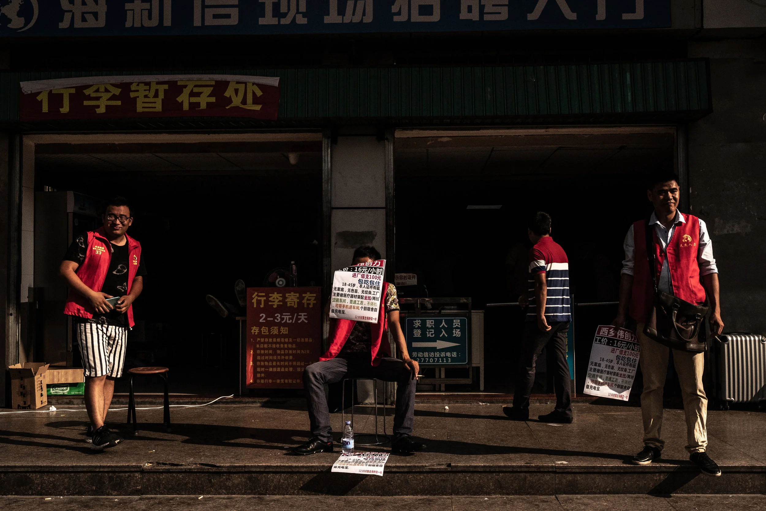  5/21/2018 Shenzhen, China  Day-labor recruiters workers advertised for positions available for skilled and unskilled work outside one of the many human labor agencies in Shenzhen, China. Once known as the world's factory, Shenzhen has developed into