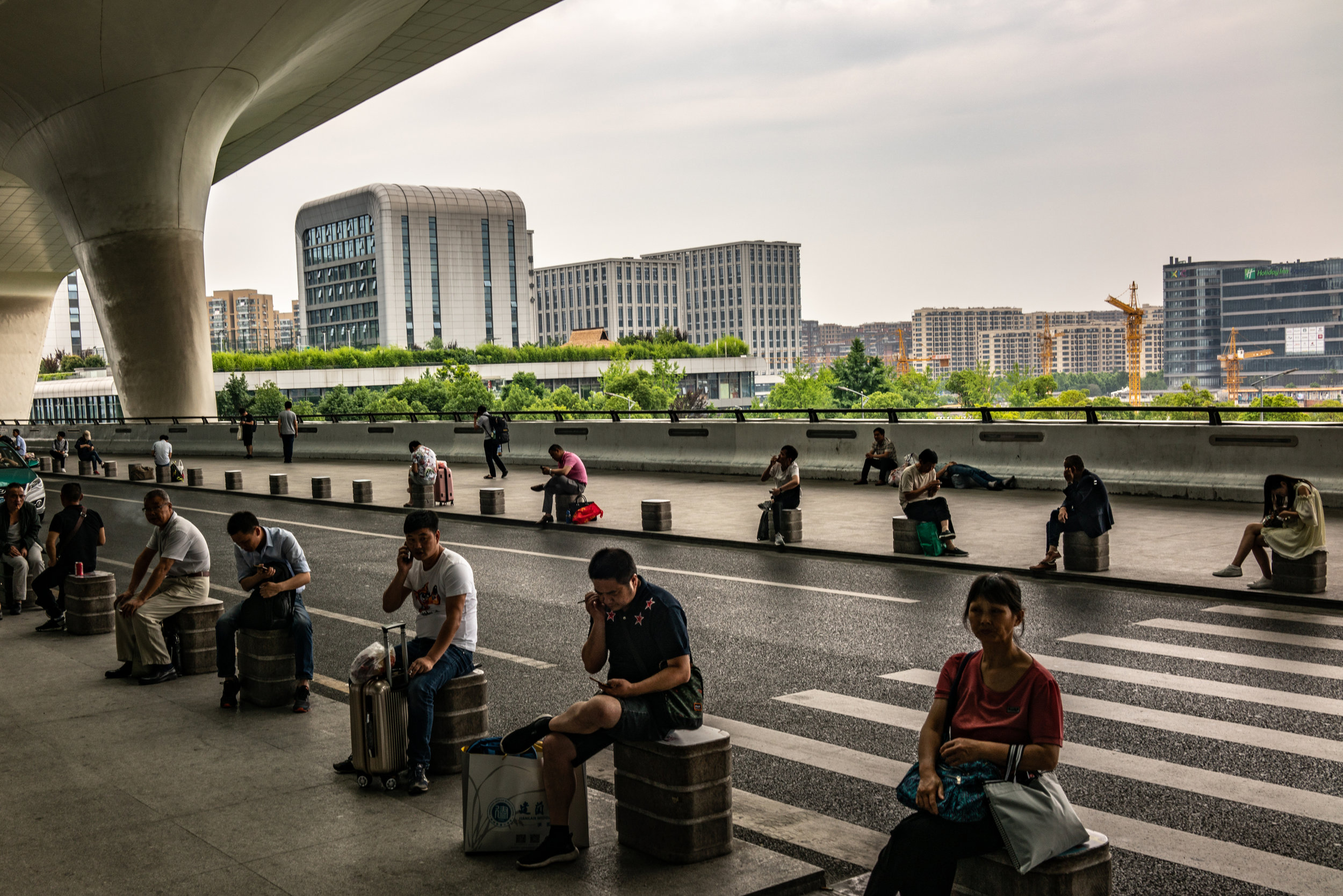  5/24/2018 Hangzhou, China  Passengers waited outside the Hangzhou railway station. China's state owned and operated high speed rail network, the largest in the world, has altered the way China's population moves. 