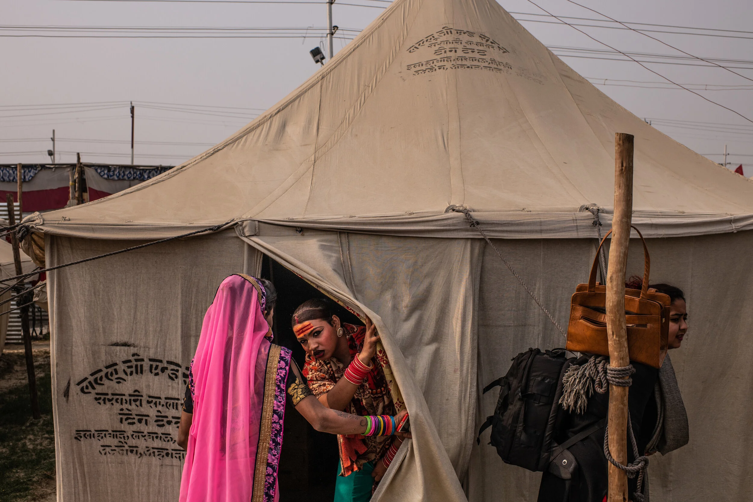  2/5/2019 Prayagraj, Uttar Pradesh, India  A transgender member of the Kinnar Akhara peaked her head out of one of the tents at the Akhara's camp, in the Kumbh Nagari (city), in Prayagraj, India, during the Ardh Kumbh Mela. For members of the Kinnar 