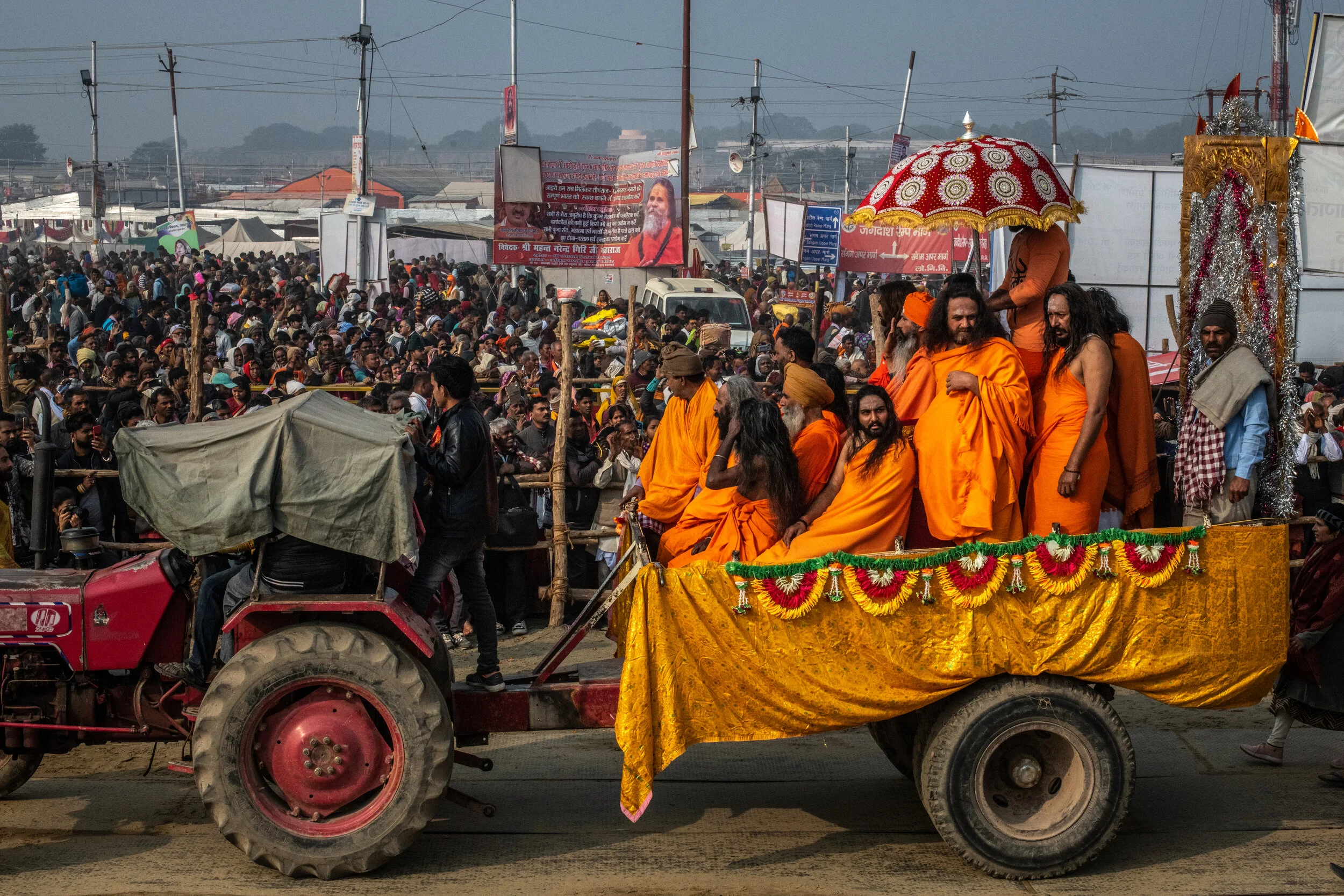  2/4/2019 Prayagraj, Uttar Pradesh, India  Hindu devotees looked on as Gurus and Akhara leaders paraded on lavishly decorated carts and trucks on morning of the Mauni Amavasya, the 2nd and most auspicious of the Shahi Snan bathing ceremonies, toward 