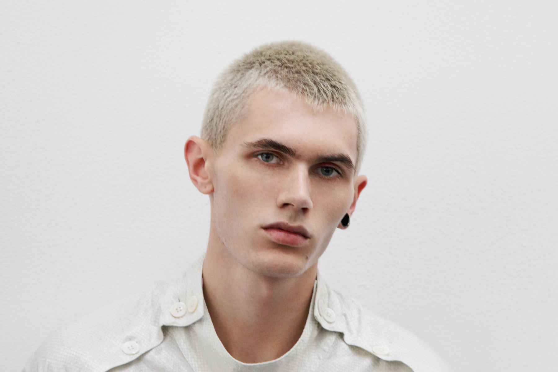 Male model backstage at Duckie Brown