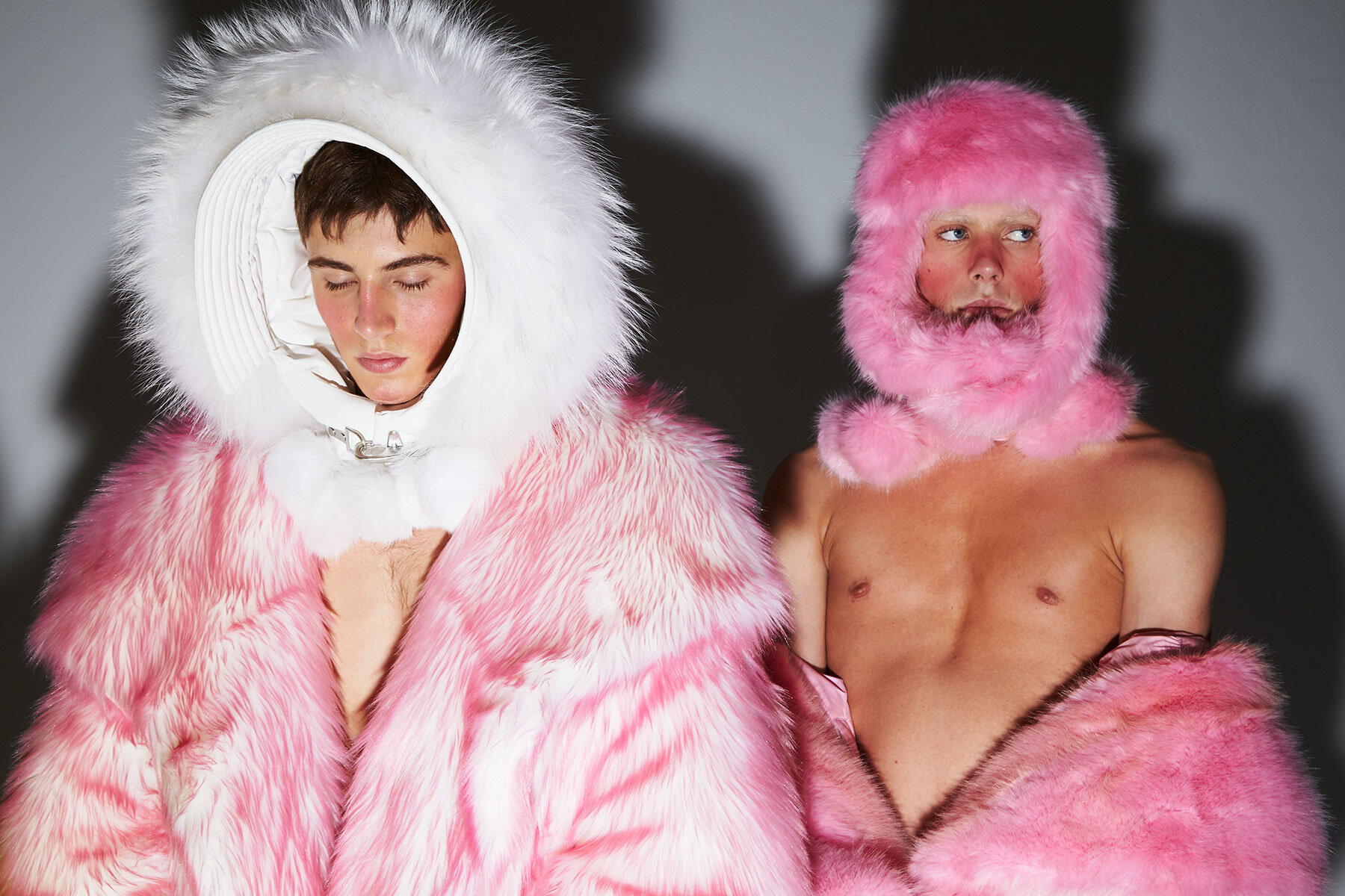 Male models in fake furs backstage at Chenpeng Fall/Winter 2019.