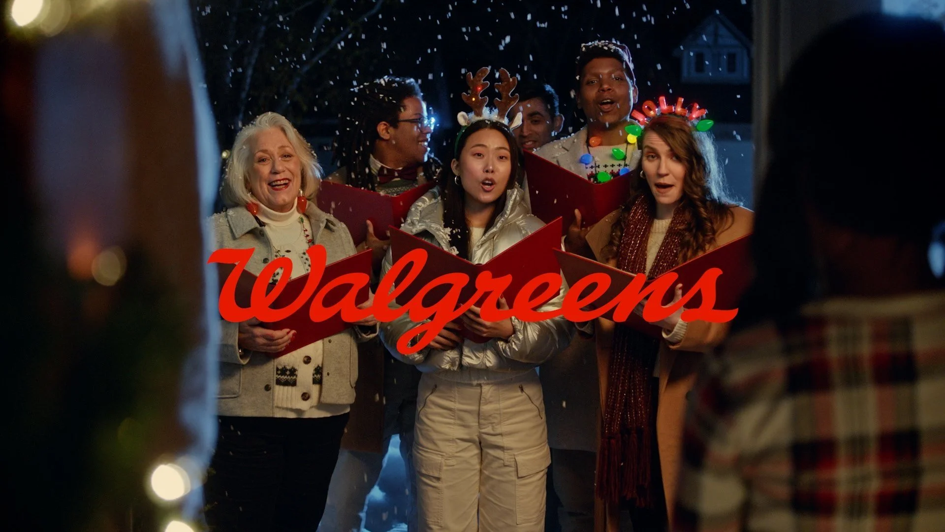 The Walgreens Carolers singing at the door.