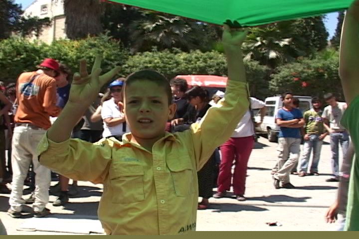 Even-boy gives peace sign.jpg
