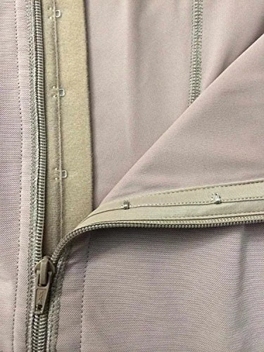 This shows soft compression fabric under trims providing padding at closure.