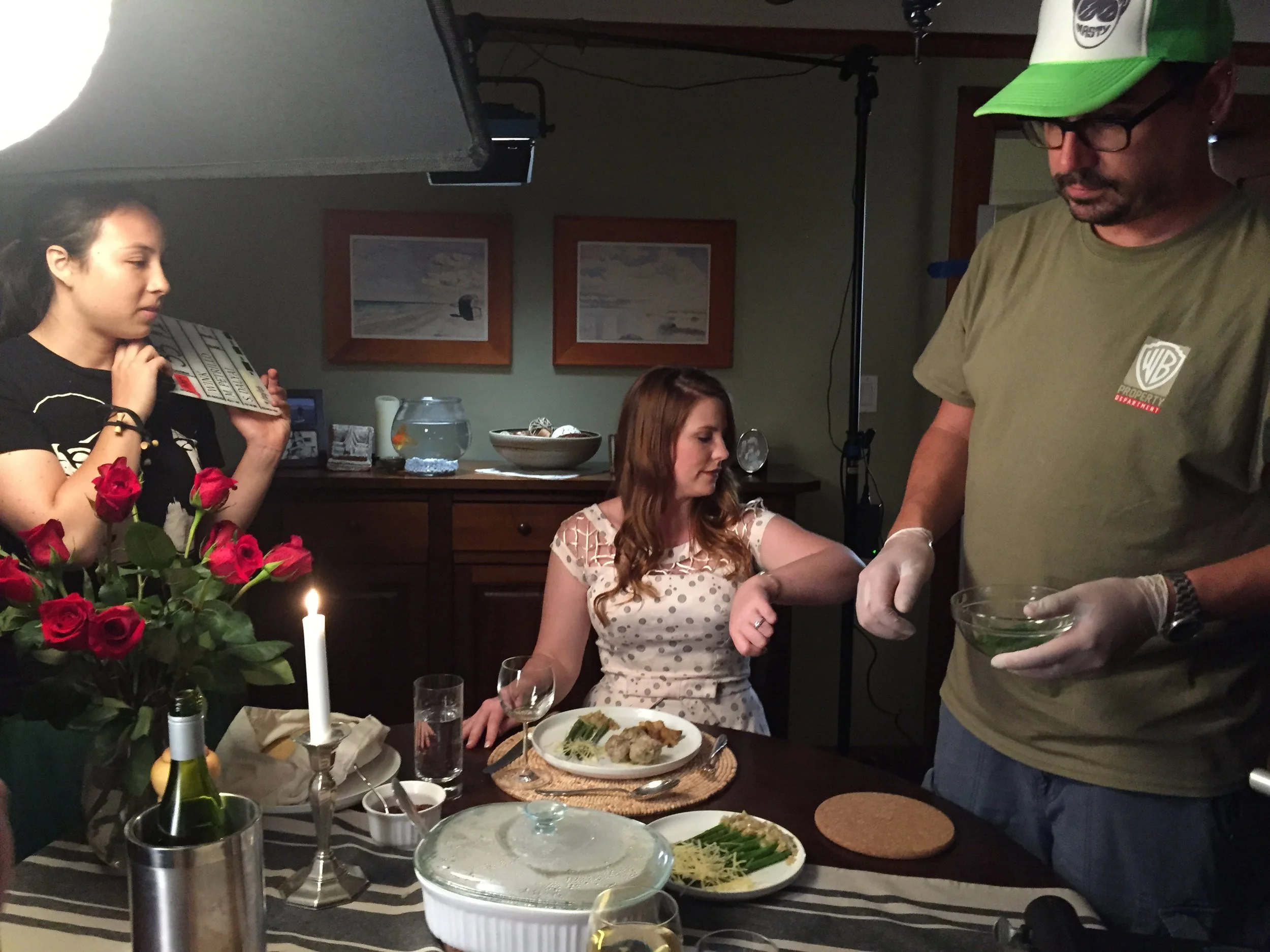 Production Designer setting up dinner for actress Caitlin Brandes