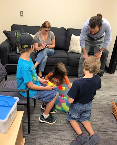 Kids have fun in the waiting room before the study begins, while parents sign a consent form.