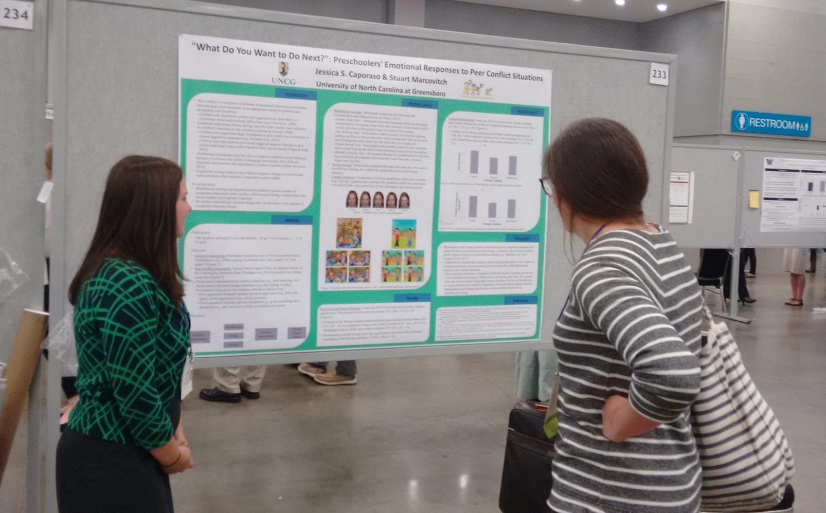  Jessica Caporaso talking to an interested colleague about the effect of children's emotions on peer interactions at SRCD 2017 