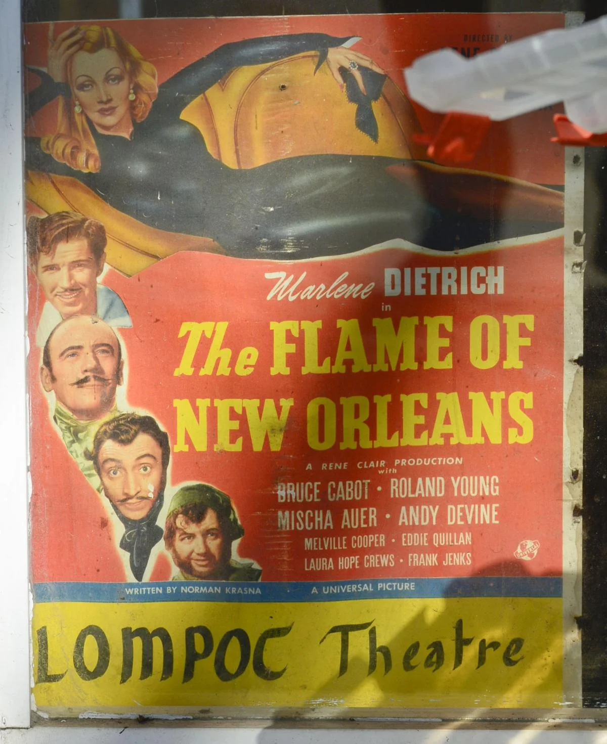 An old movie poster advertising the 1941 movie "The Flame Of New Orleans," starring Marlene Dietrich, was found inside a wall in an office at the Lompoc Theatre during renovation. (Len Wood, Lompoc Record)