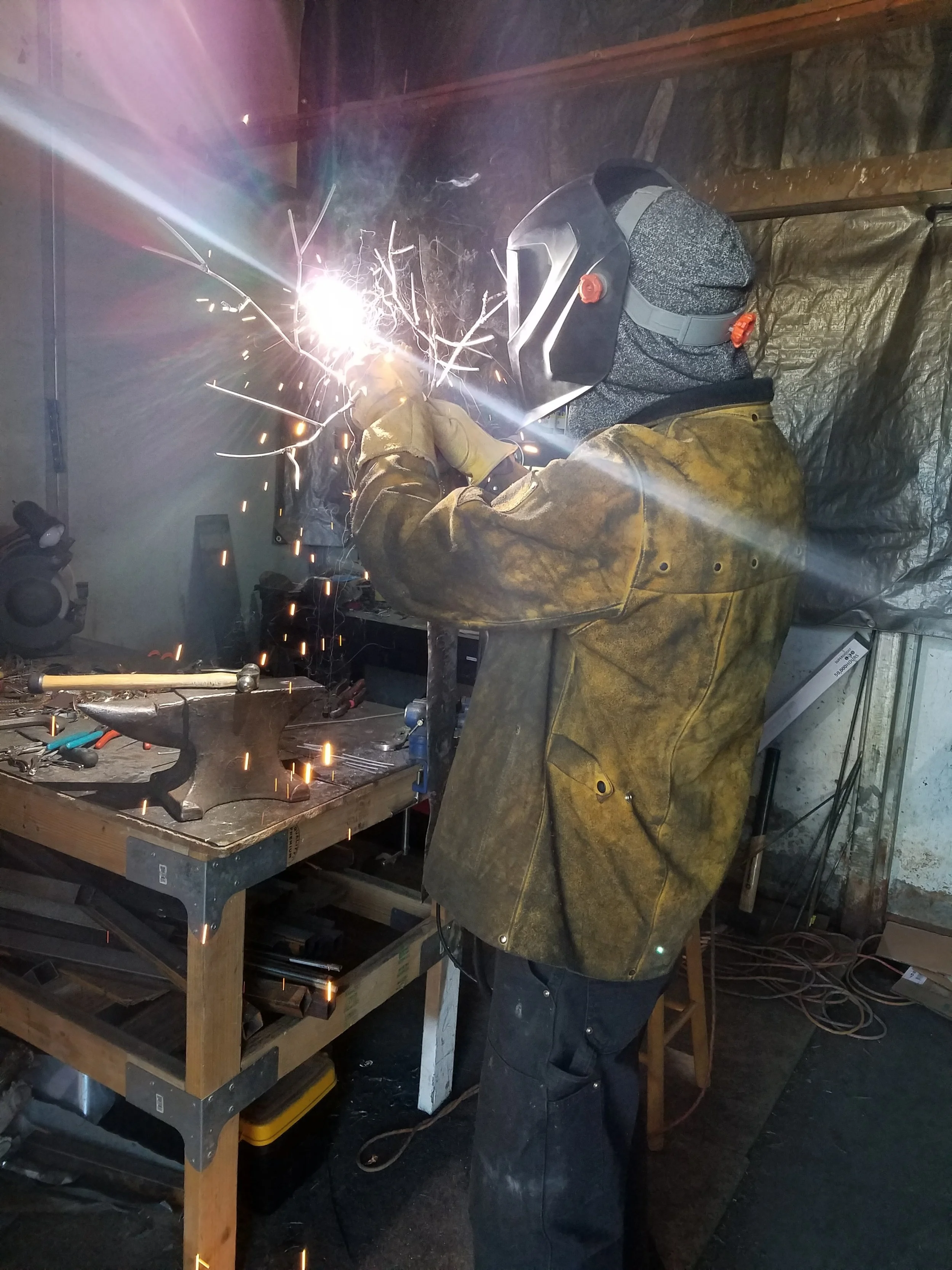 Wes welding in horse stall studio