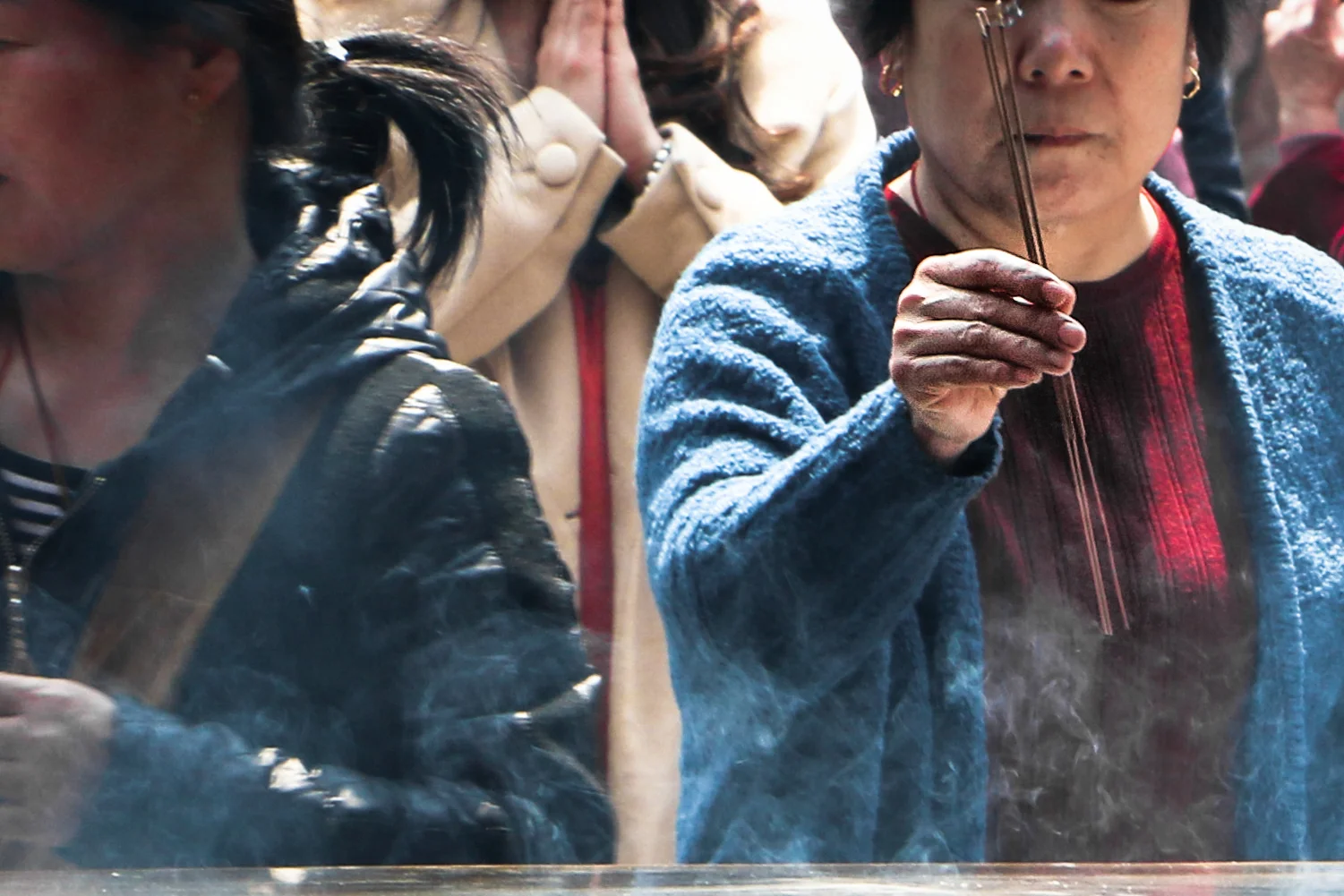 The woman who worries and prays. Shanghai, China.
