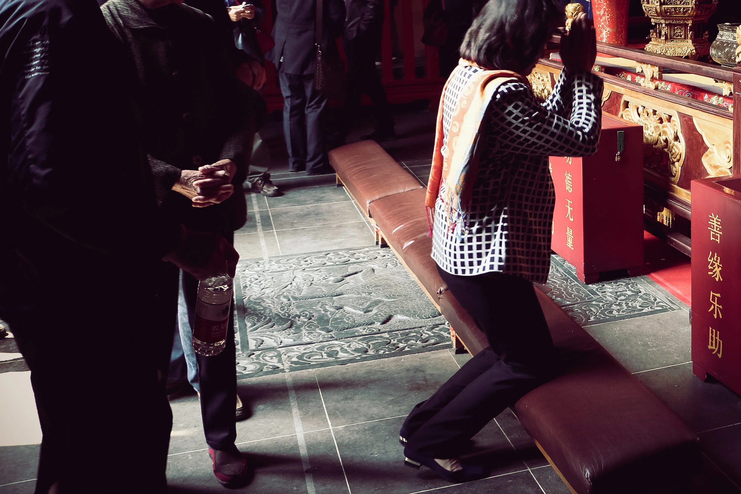 The woman who prays. Shanghai, China.