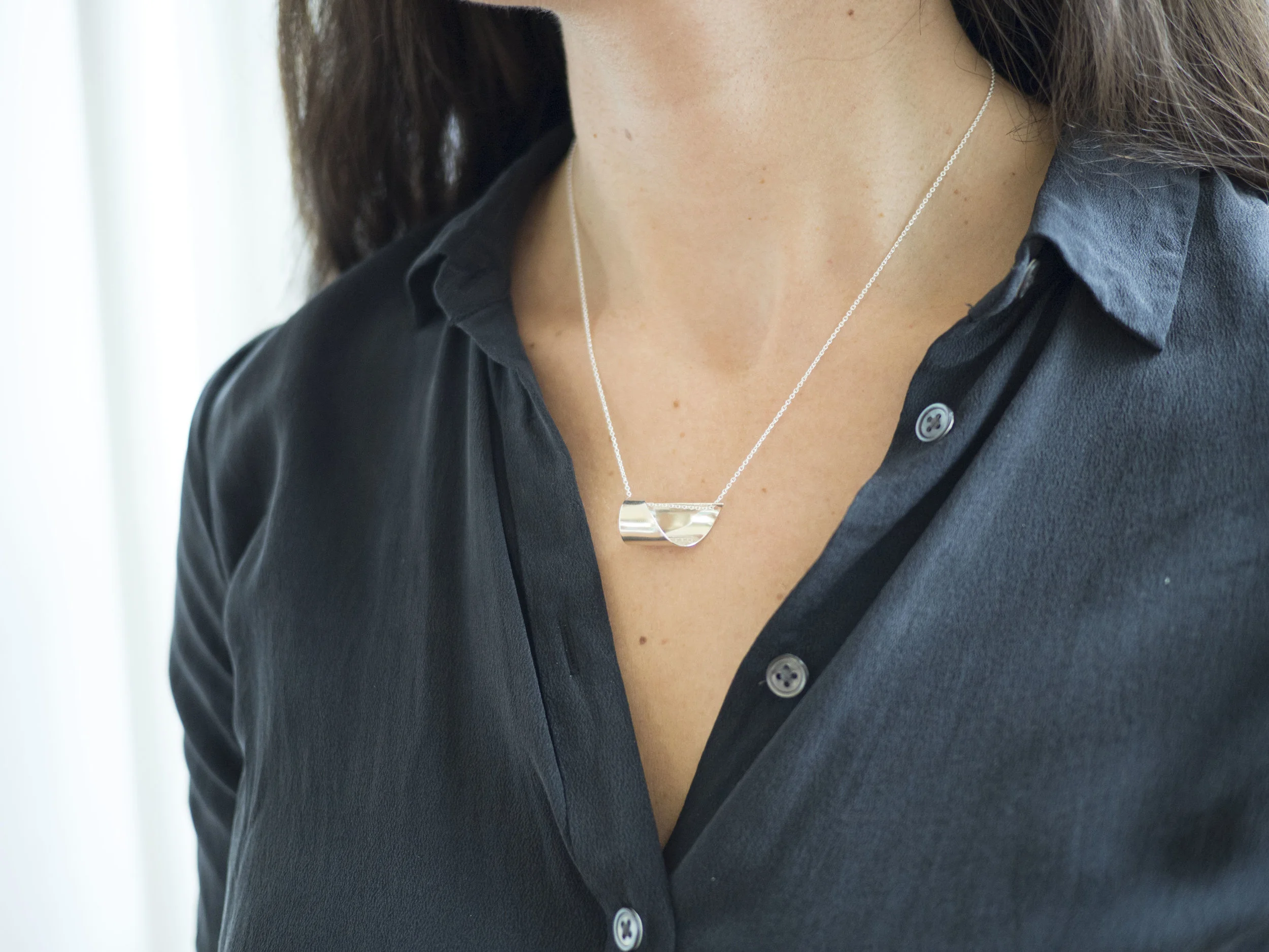 Sculptural design is smooth and comfortable to wear.