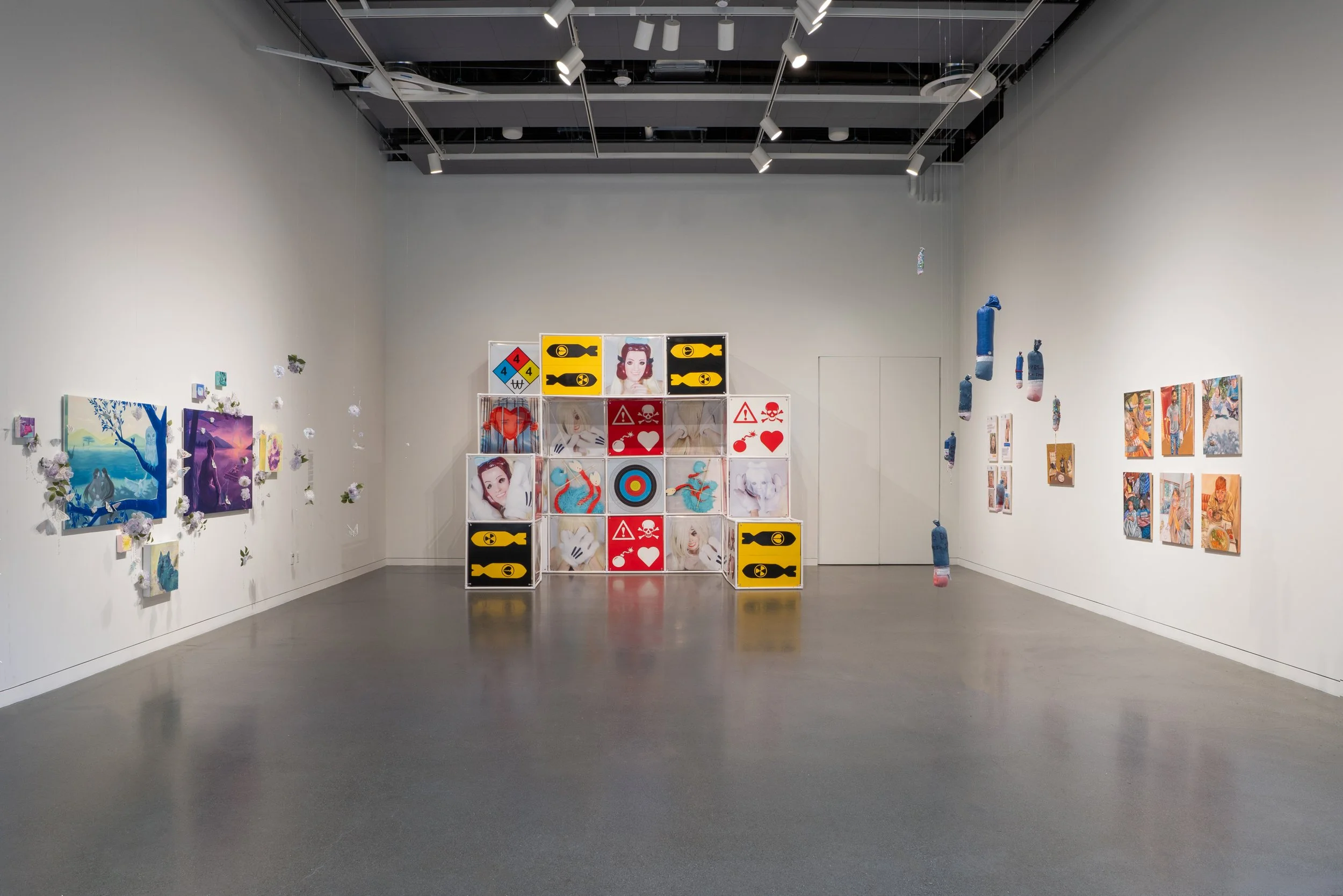 An Attraction (2025) Installation with polyvinyl chloride pipe, inkjet prints on celluloid film, maple plywood coated in federal standard Occupational Safety and Health Administration (OSHA) enamel paint and polyurethane high gloss, silver gromme