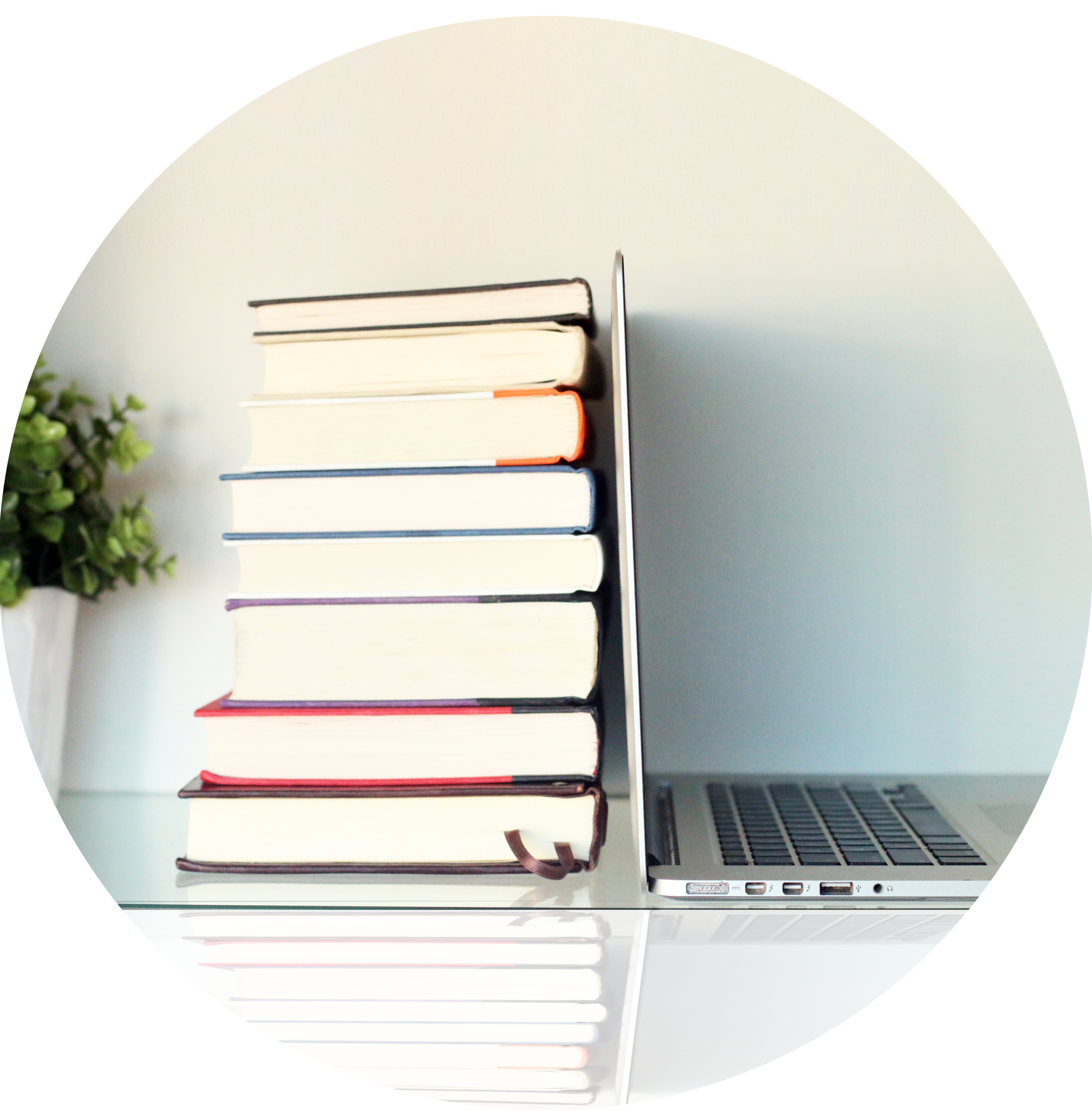 stock-photo-stack-of-books-and-laptop-on-wooden-table-370931219-1.jpg