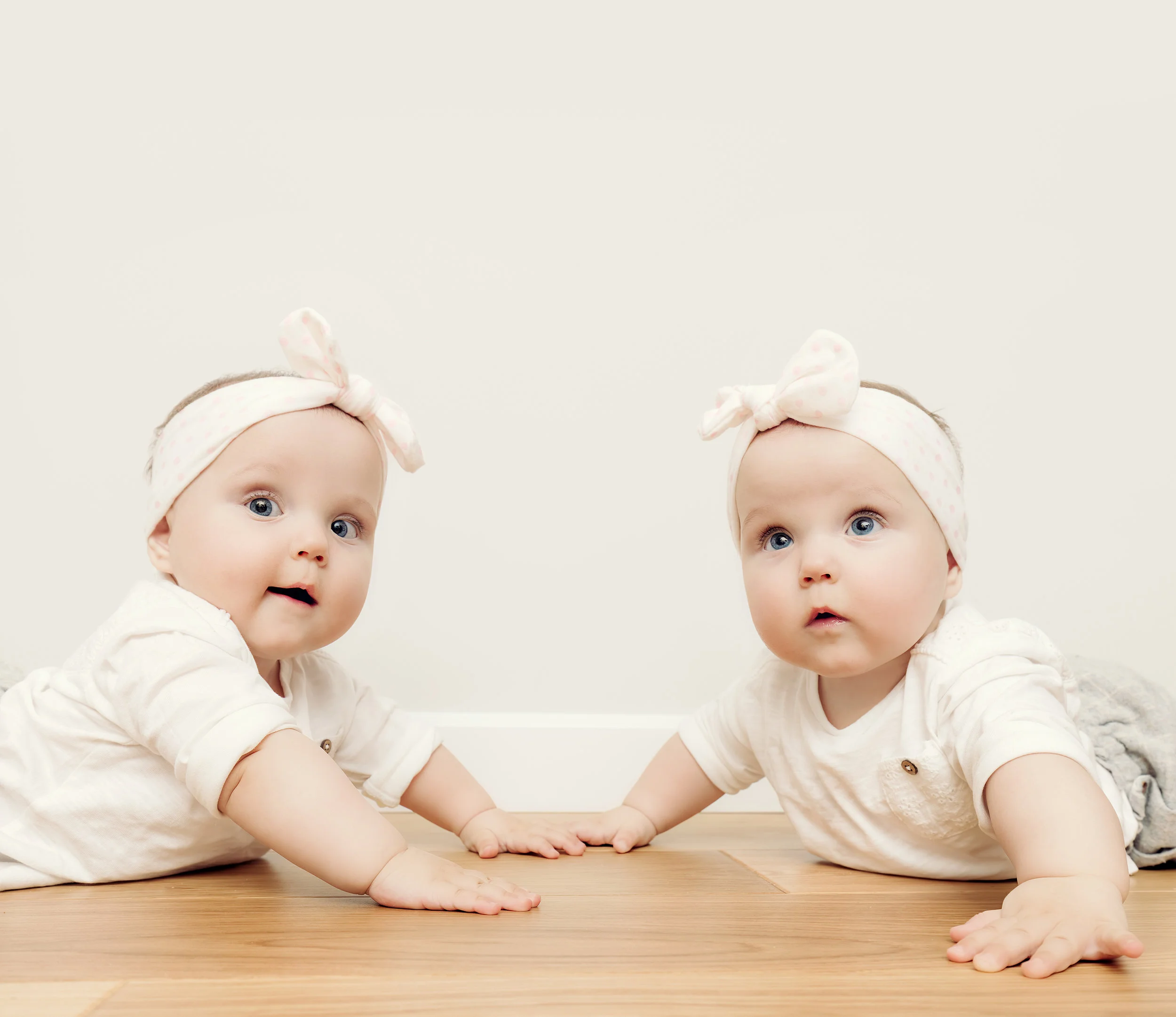 bigstock-Cute-baby-twin-sisters-crawl-t-148915172.jpg