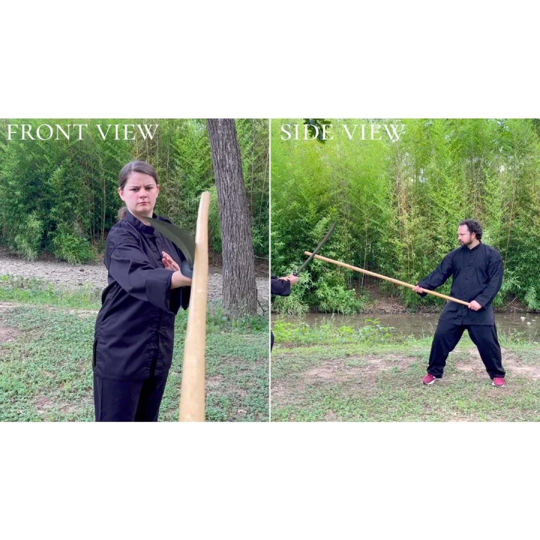 two view points, side on and first person, of staff versus sword between two chinese martial arts practitioners, one male and one female.