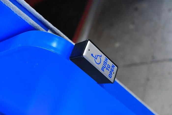 AUTO DOOR PUSH PAD ON BARRIER.jpg