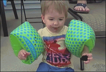 Kidtryingtoeatcookie.gif