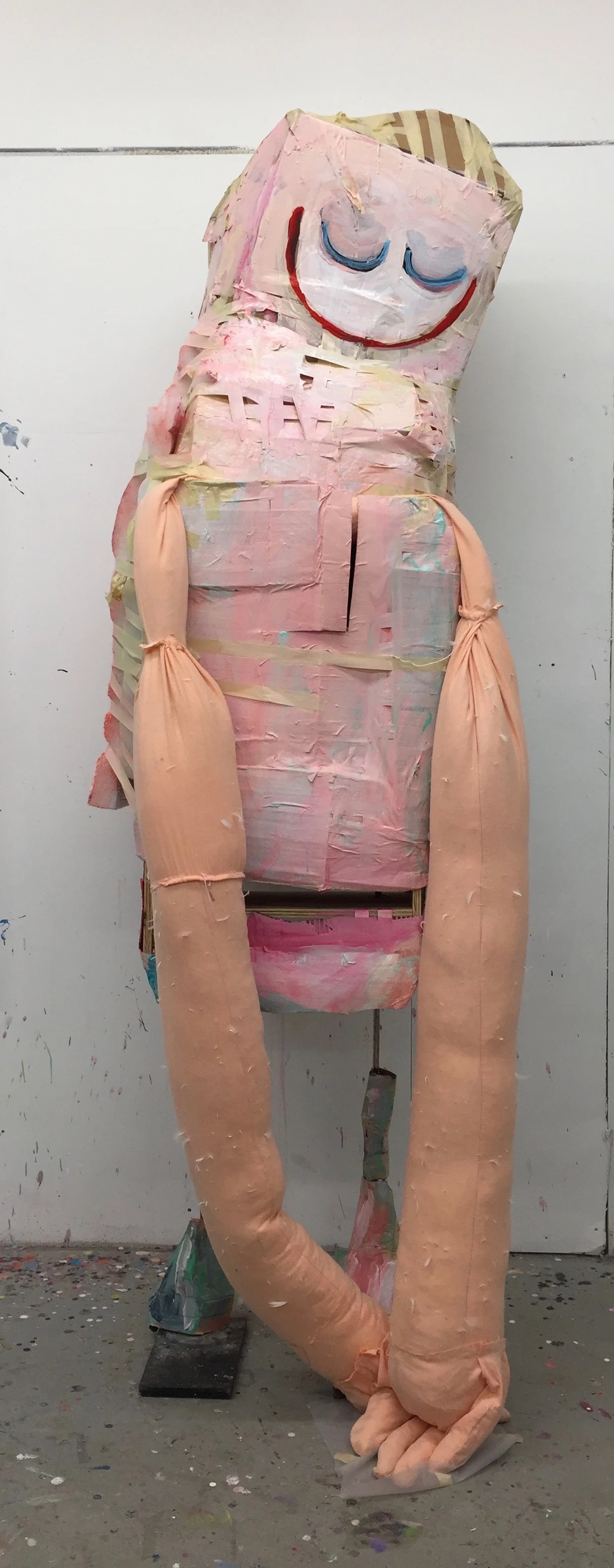 Her Hugs (2017), Acrylic on cardboard, masking tape, batting, and wood frame on metal legs, 94" x 36" x 26"