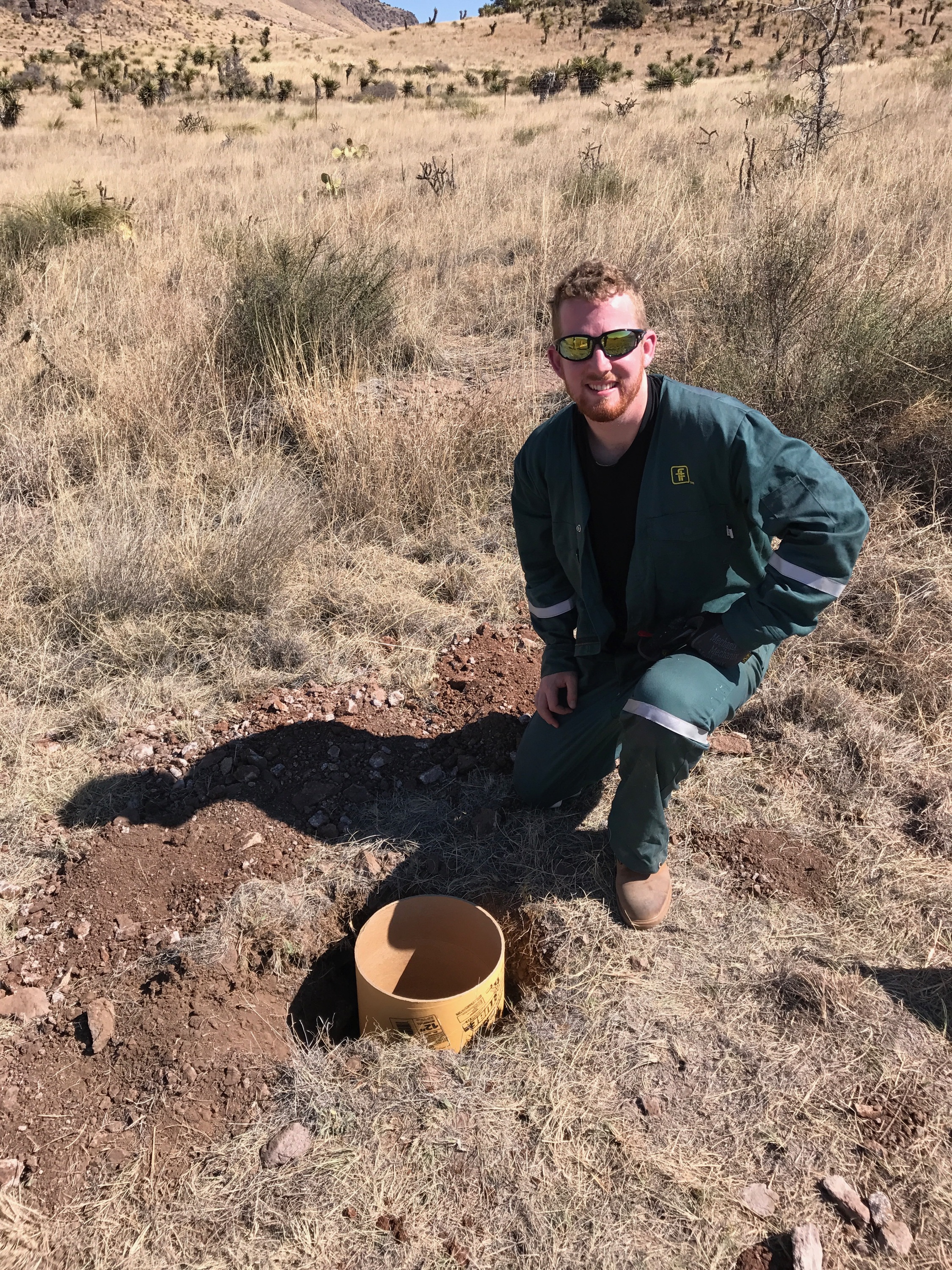 George next to the first finished footing hole.