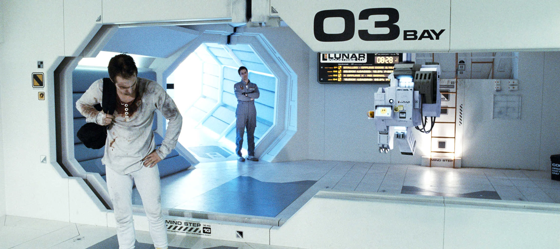 Moon , 2009, film still showing a decaying old Sam, the new Sam and Gerty, dir. Duncan Jones.
