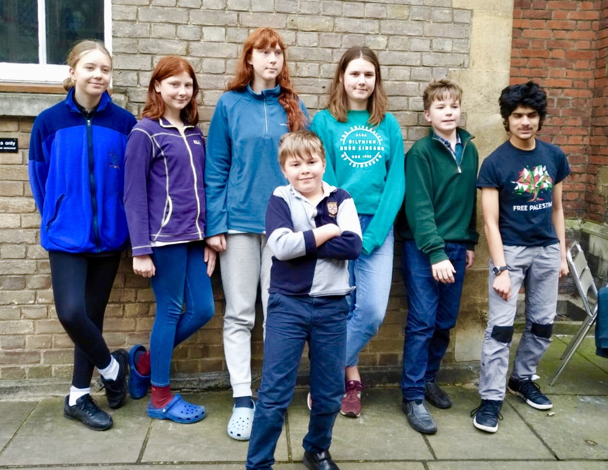Outside Michaelhouse Cafe, in front Nico Roman, 10, King's School; back row from left are Snaedis Fridriksdottir, 14, of Coleridge School; Ella Hone, 11 and Samaya Hone 18, Chesterton School and Helena Davis, 18, of Hills Road Sixth Form College; Jona David, 13, King's School; and Junayd Islam, 15, of Parkside School.