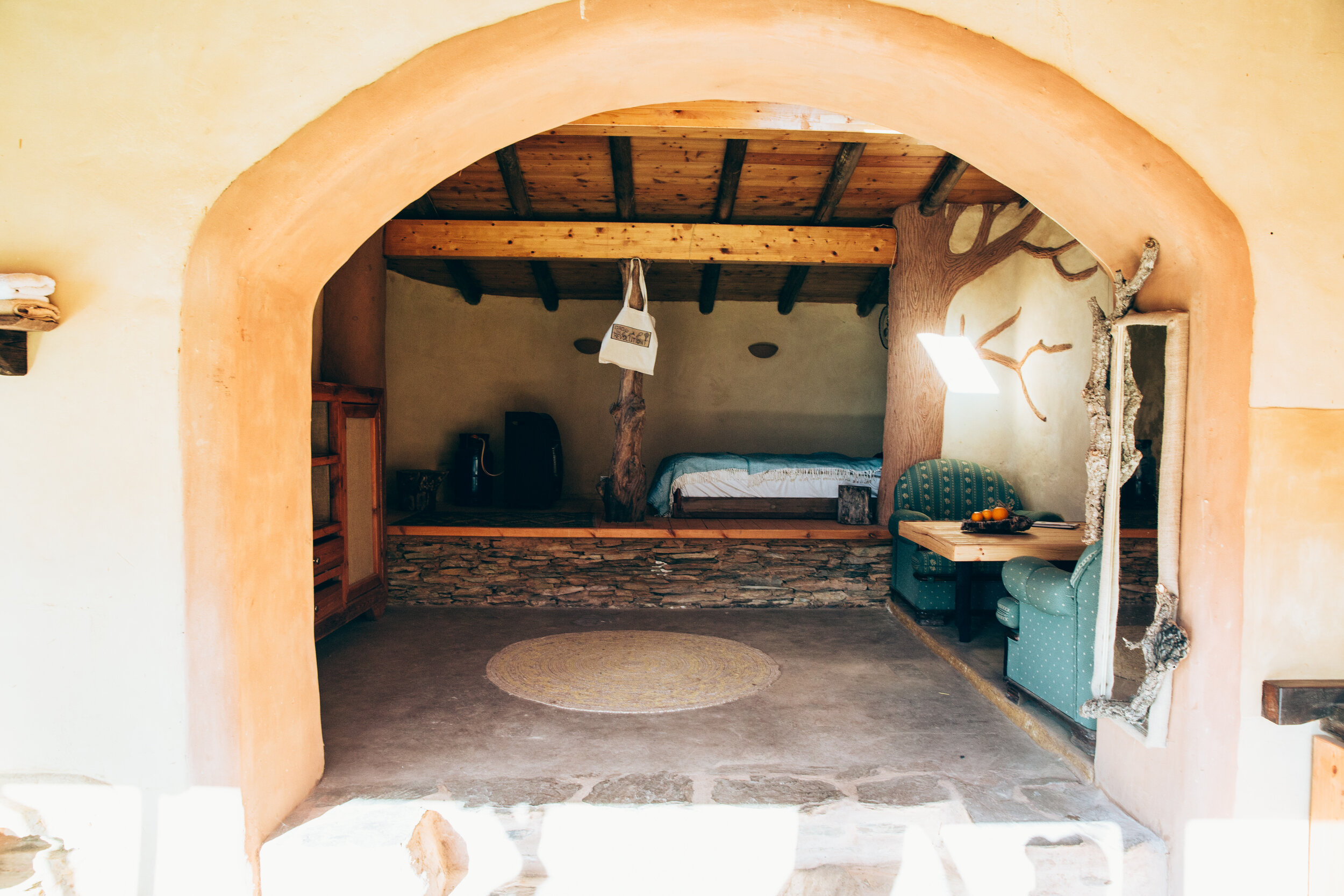 casa-do-pomar-interior-stone-bed-platform-archway.jpg.jpg