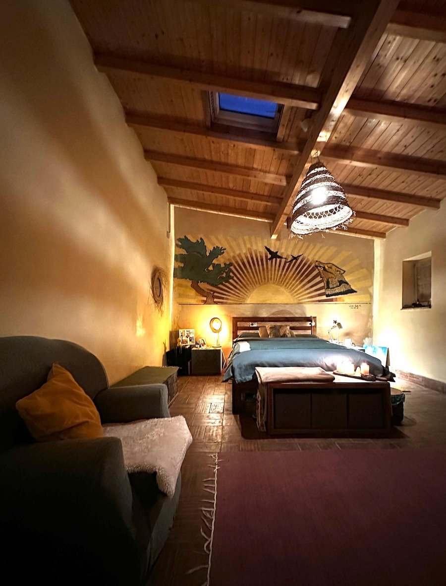 por-do-sol-room-off-grid-farm-co-living-double-bed-sun-mural-night.jpeg