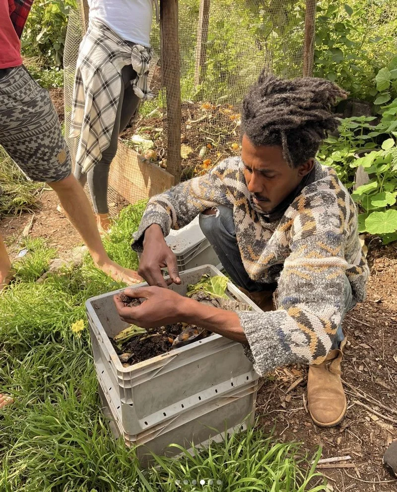 Facilitator Kyle demonstrating soil health and plant care techniques to students at A Quinta.